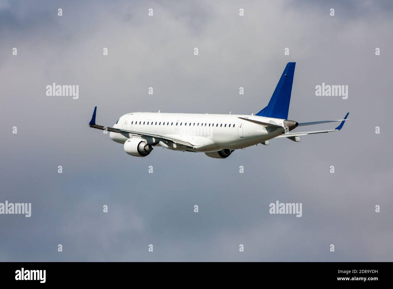 White passenger jet plane in the air on take-off Stock Photo - Alamy