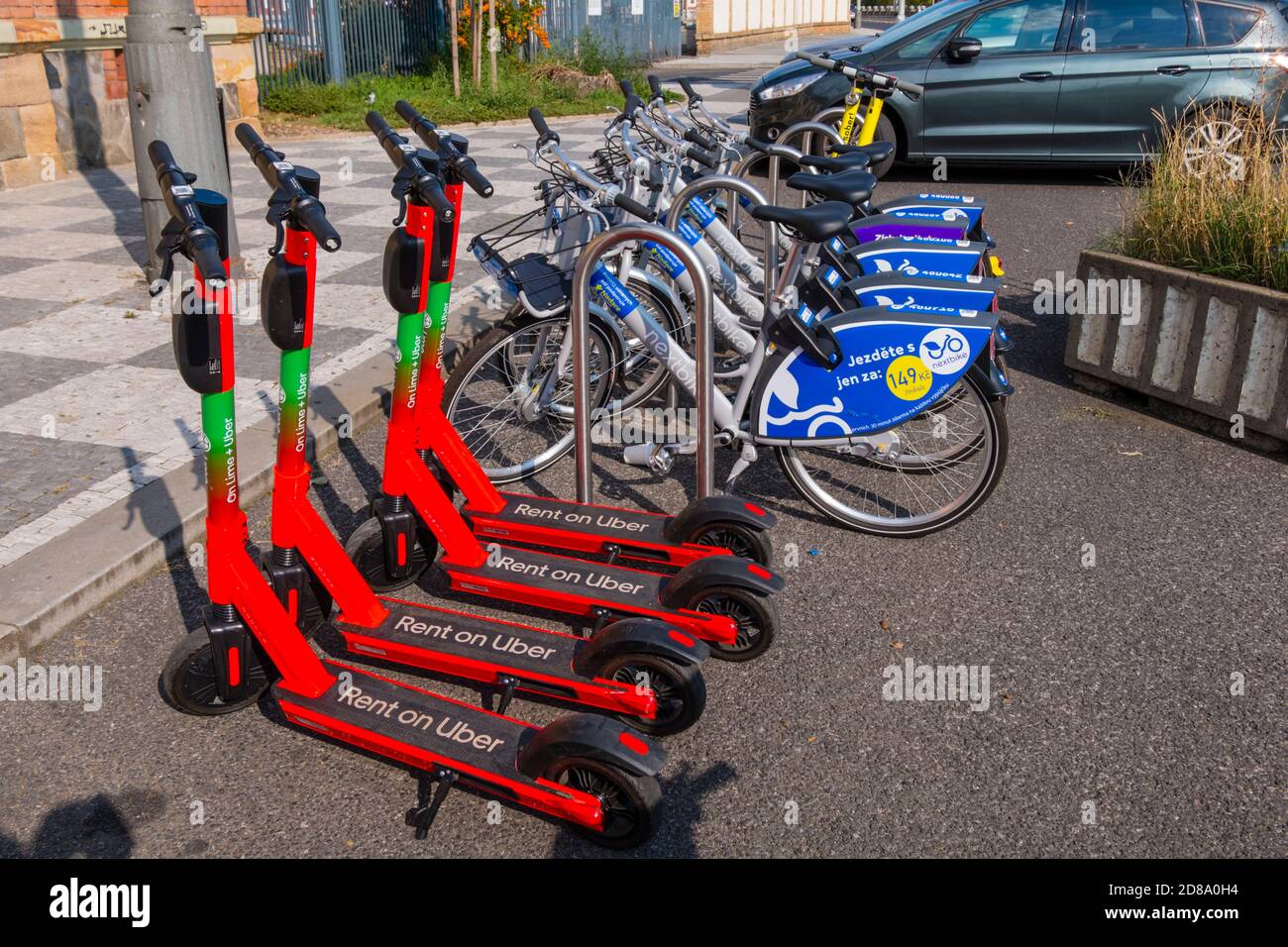 Electric kick scooters and city bikes, in front of Holesovice market, Prague,  Czech Republic Stock Photo - Alamy