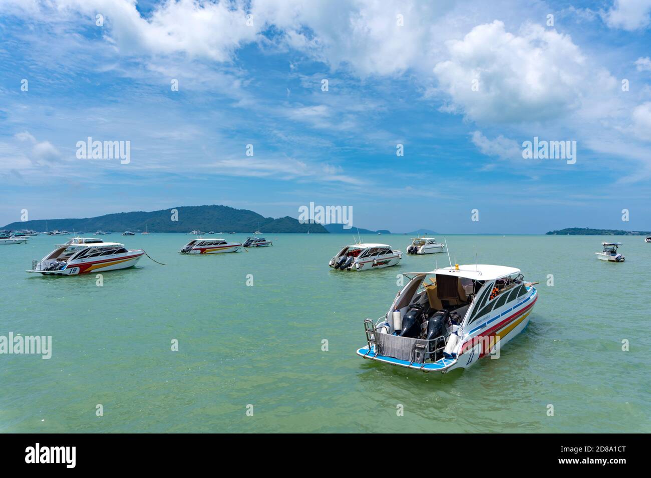 Phuket, Thailand - August 06, 2020: Group of speed boats park at Chalong Bay Pier. Stock Photo