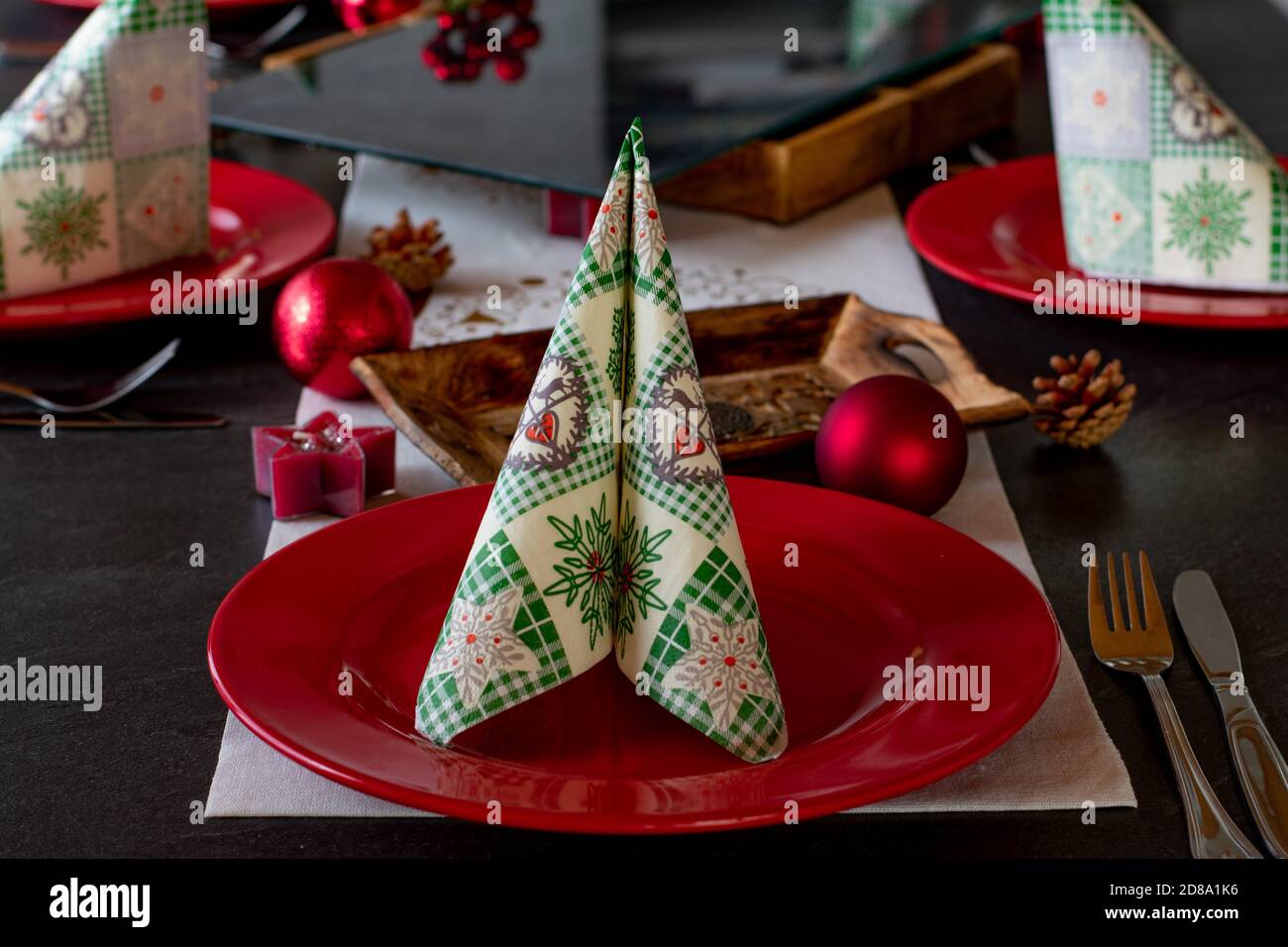 Christmas table setting with red plates Stock Photo