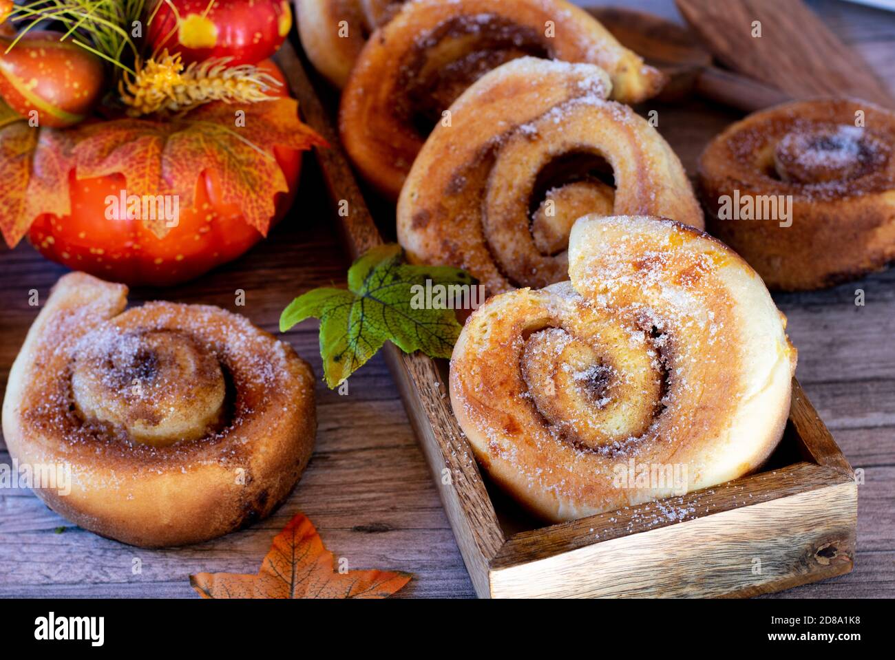 fresh baked cinnamon rolls on wood table Stock Photo