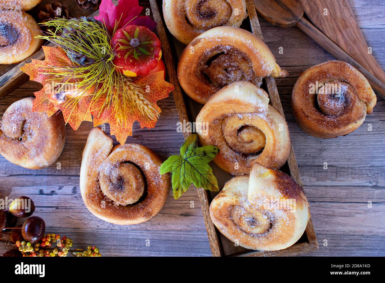 fresh baked cinnamon rolls on wood table Stock Photo