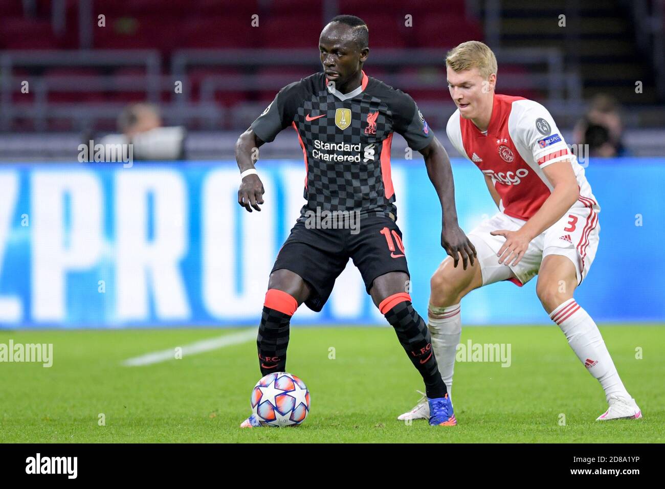 Sadio Mane of Liverpool FC, Perr Schuurs of Ajax during the UEFA Champions League, Group Stage, Group D football match between Ajax and Liverpool on C Stock Photo