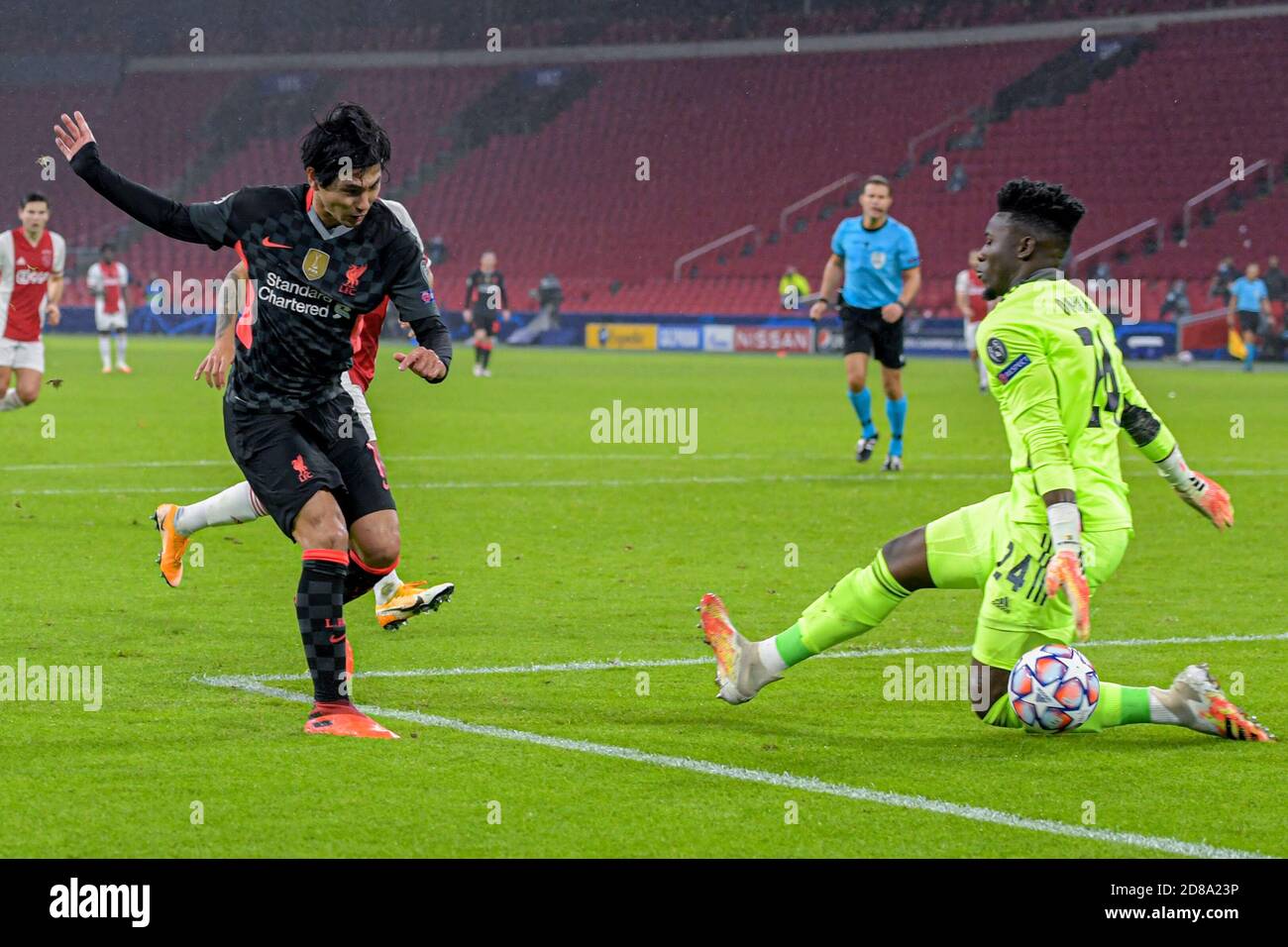 Takumi Minamino of Liverpool FC, Andre Onana of Ajax during the UEFA Champions League, Group Stage, Group D football match between Ajax and Liverpoo C Stock Photo