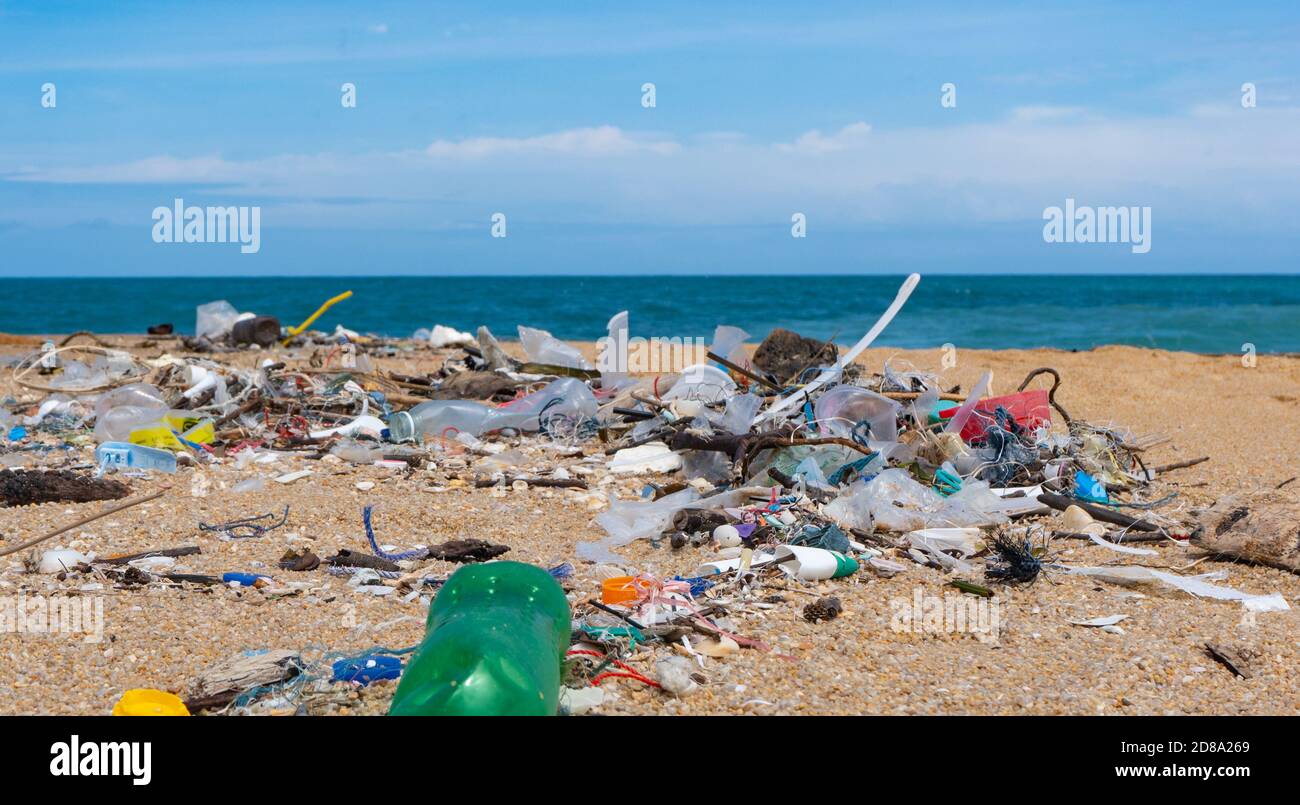 Plastic waste environment pollution on Mai Khao Beach, Phuket, Thailand. Stock Photo