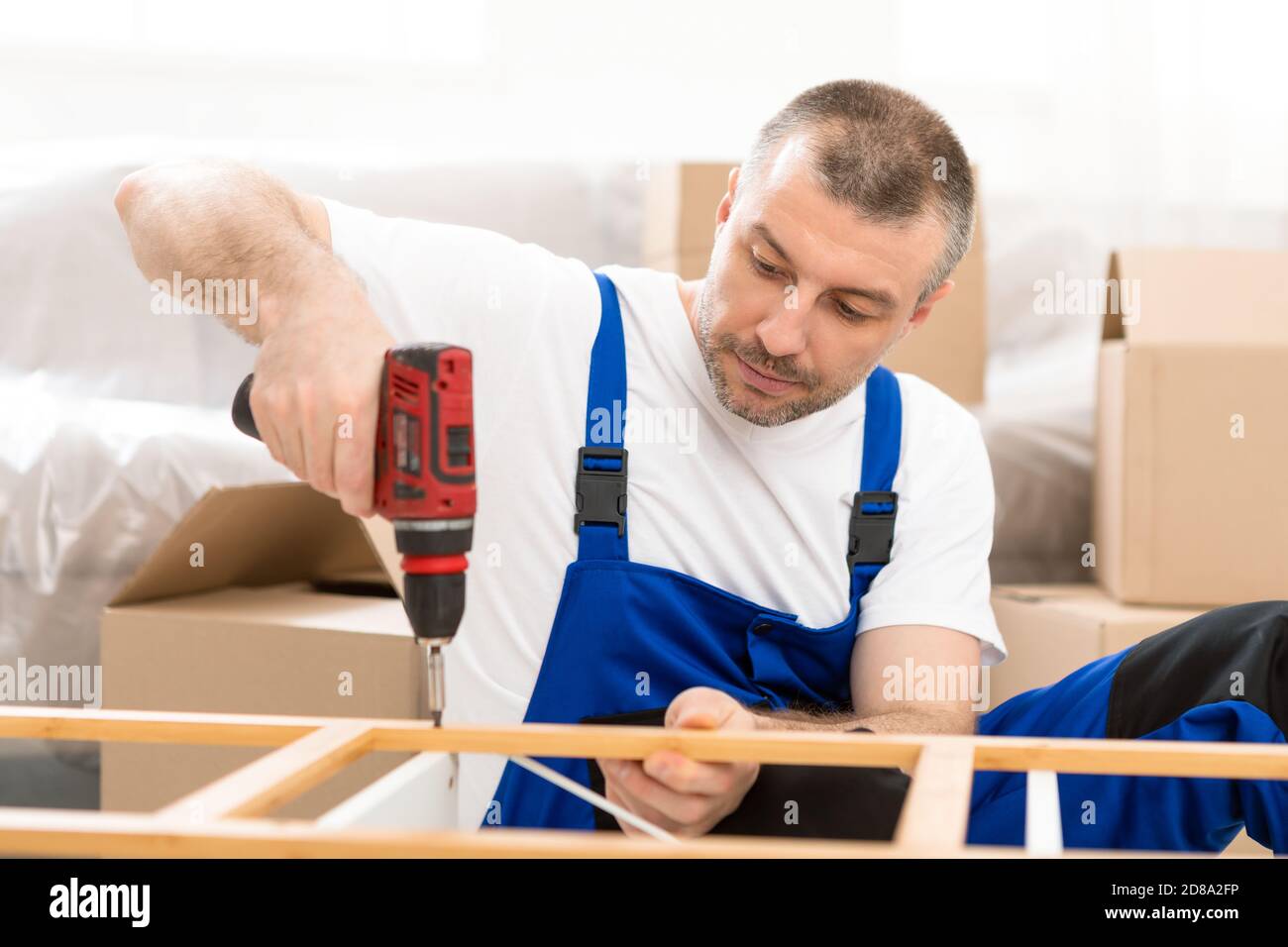 Furniture Assembler Assembling Working Using Electric Drill
