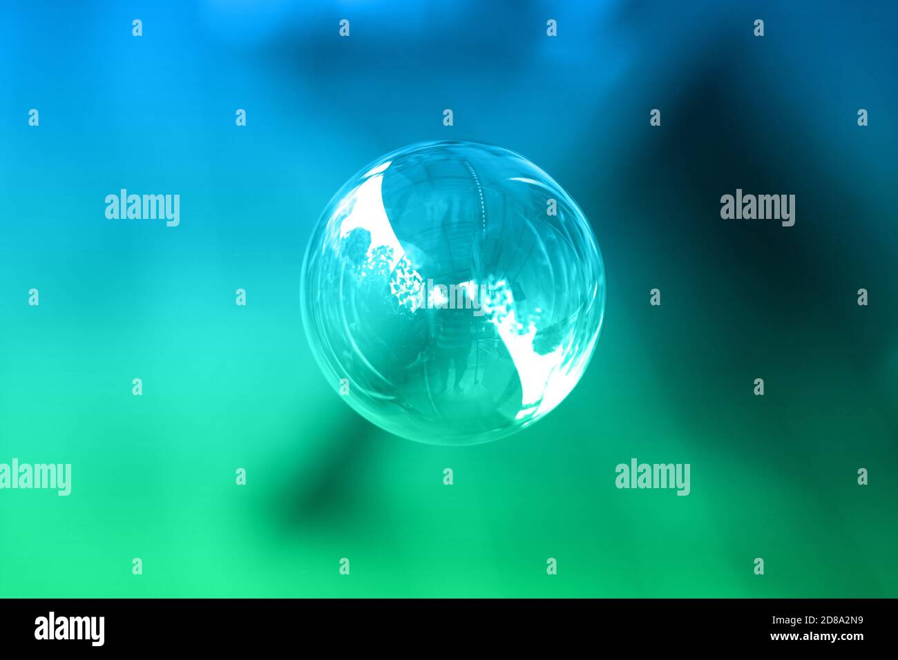 1 soap bubble on a green and blue background. Stock Photo