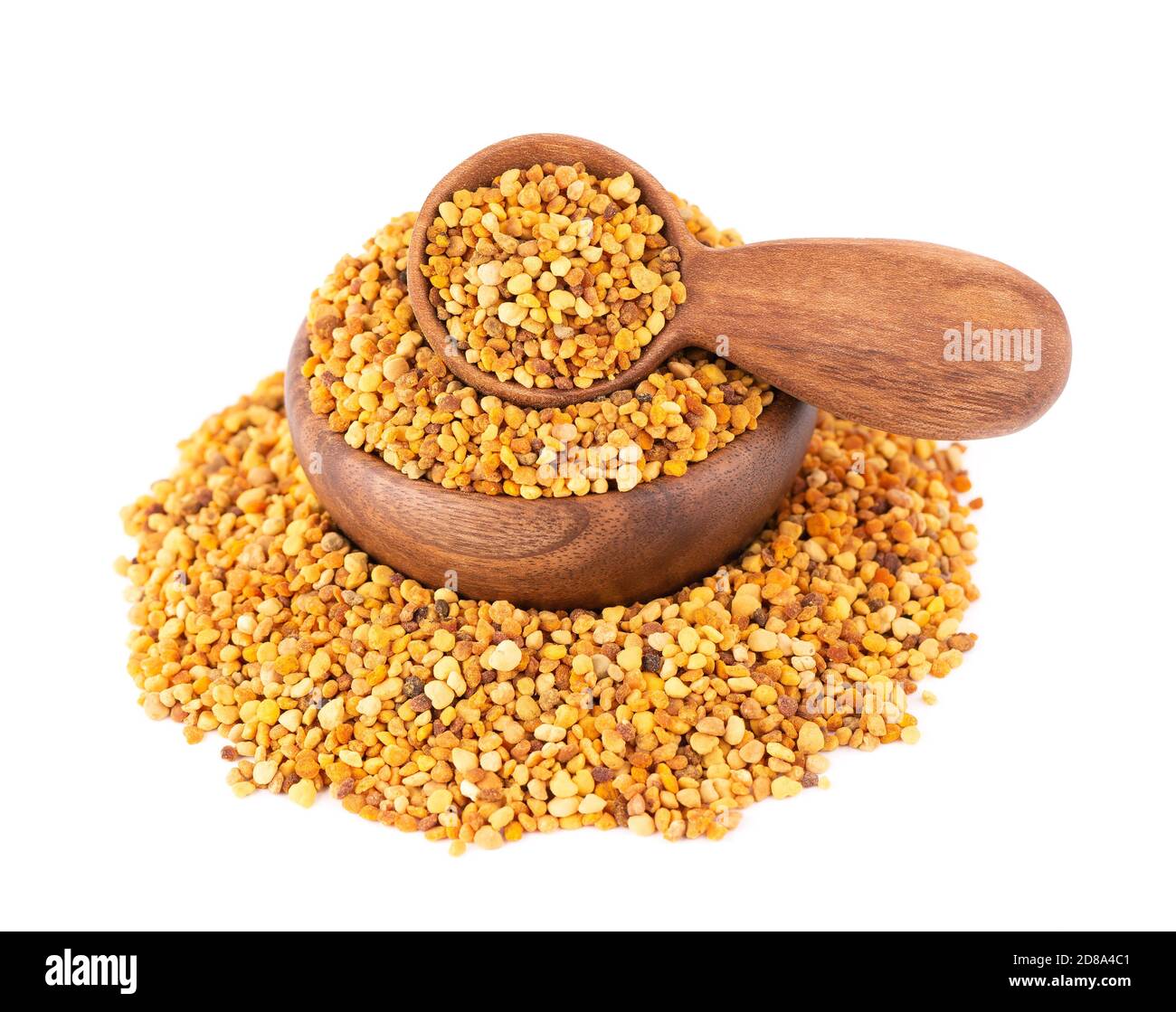 Flower pollen grains in wooden bowl and spoon, isolated on white background. Pile of bee pollen or perga. Stock Photo