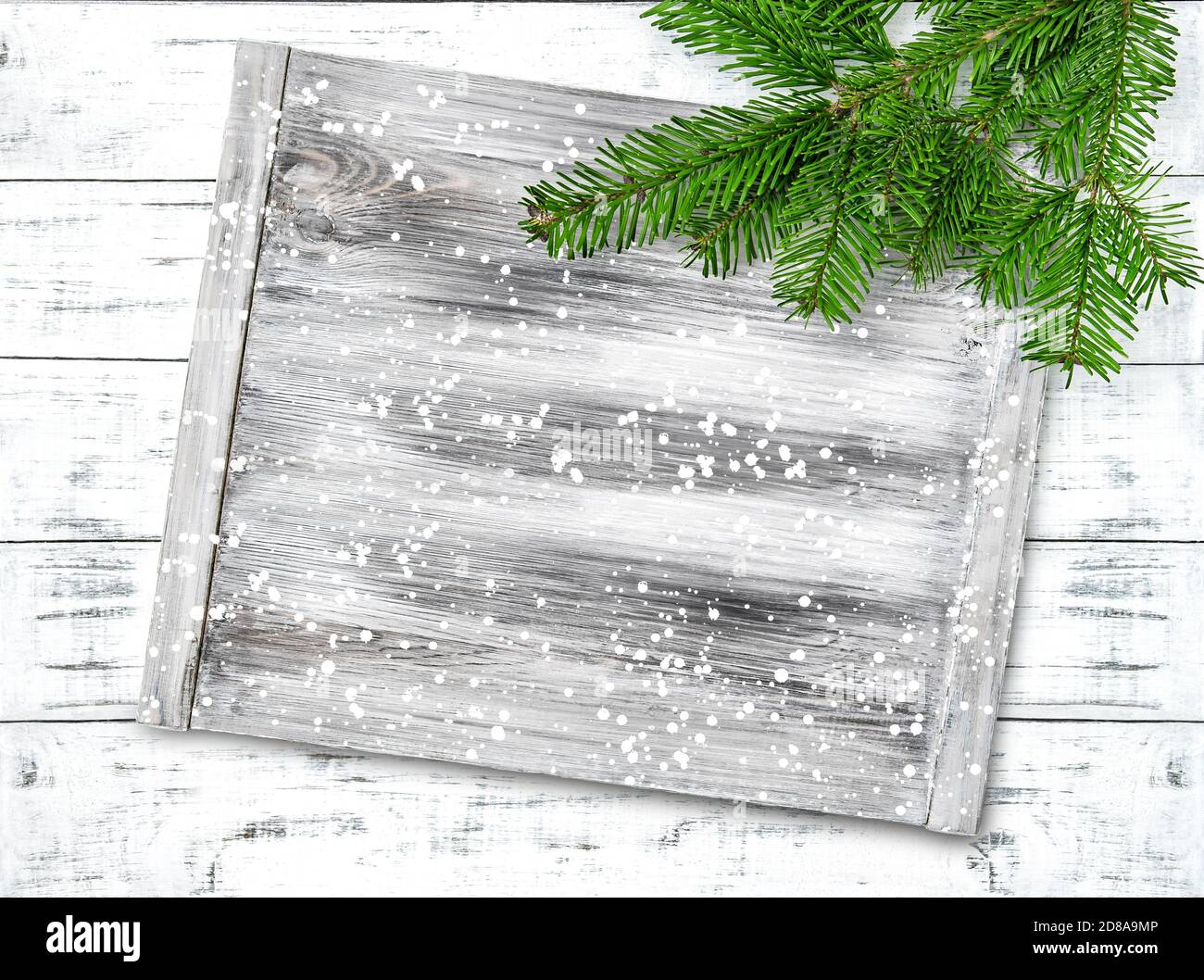 Christmas tree branches and wooden sign desk board mockup Stock Photo
