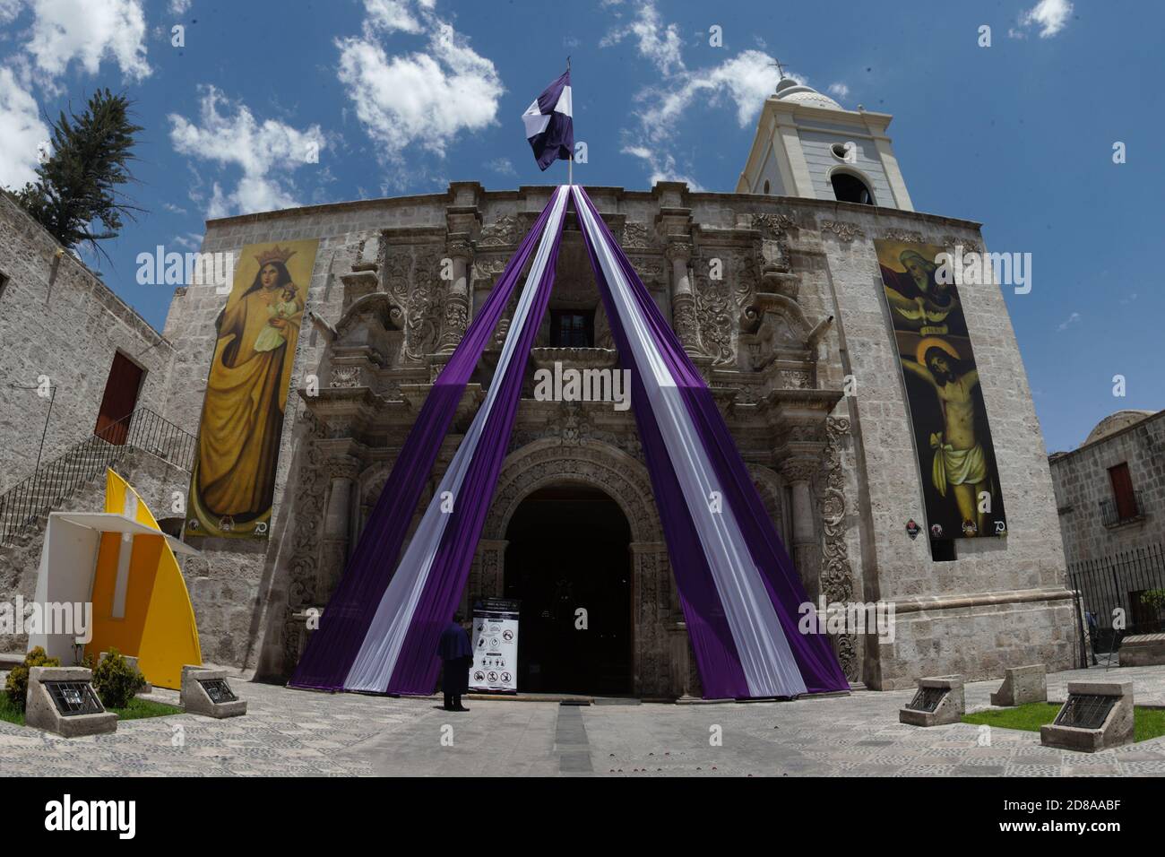 Believers in the 'Lord of Miracles' come to the temple of San Agustín (Arequipa) to pray to the image of the 'Purple Christ'. All health protocols wer Stock Photo