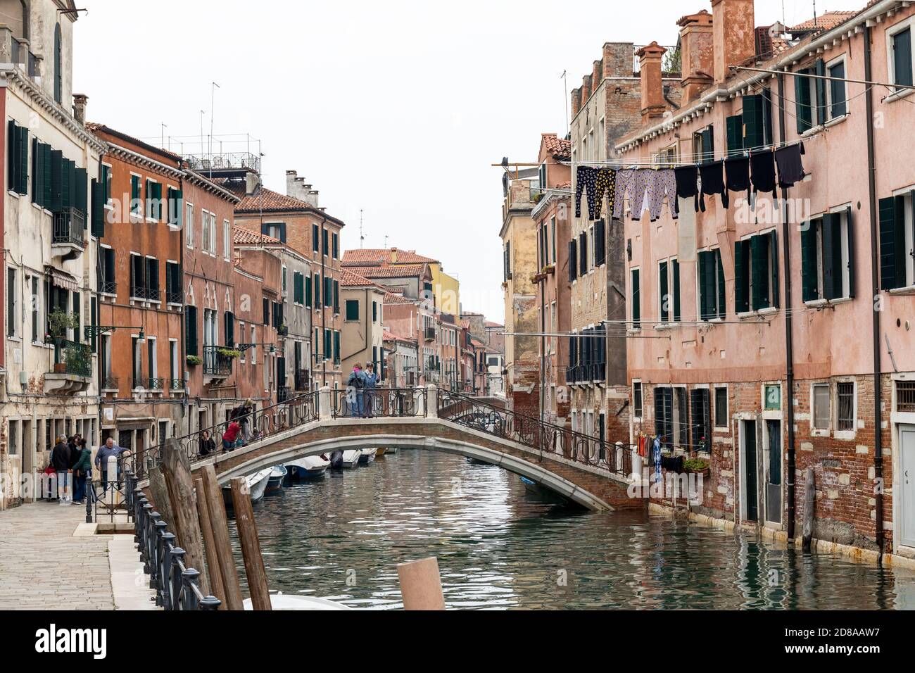 Washing hanging out to dry over the canal in Rio di Sant Anna, Castello region of Venice, Italy 2020 Stock Photo