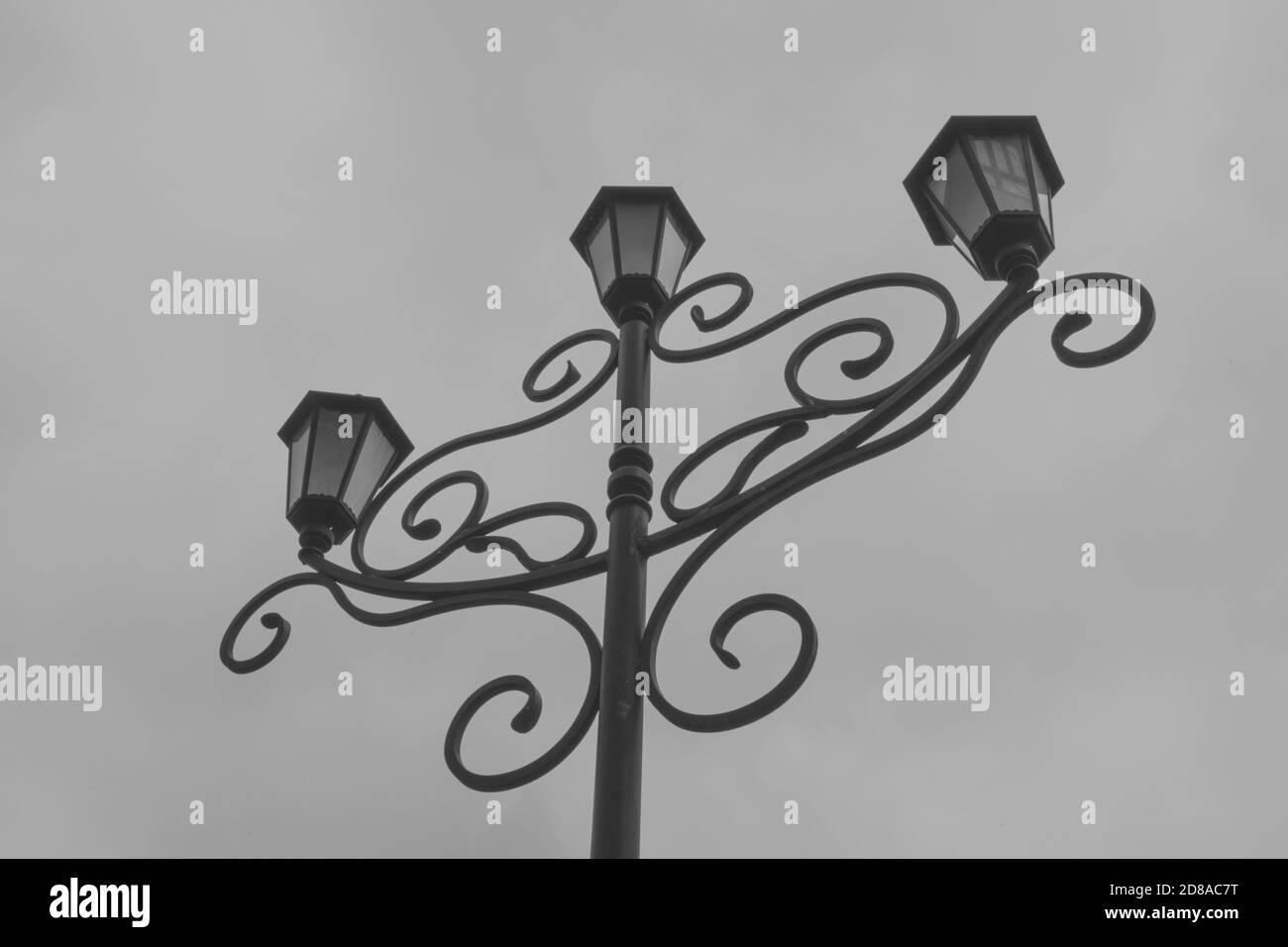 Forged lamp post, black and white photography Stock Photo - Alamy