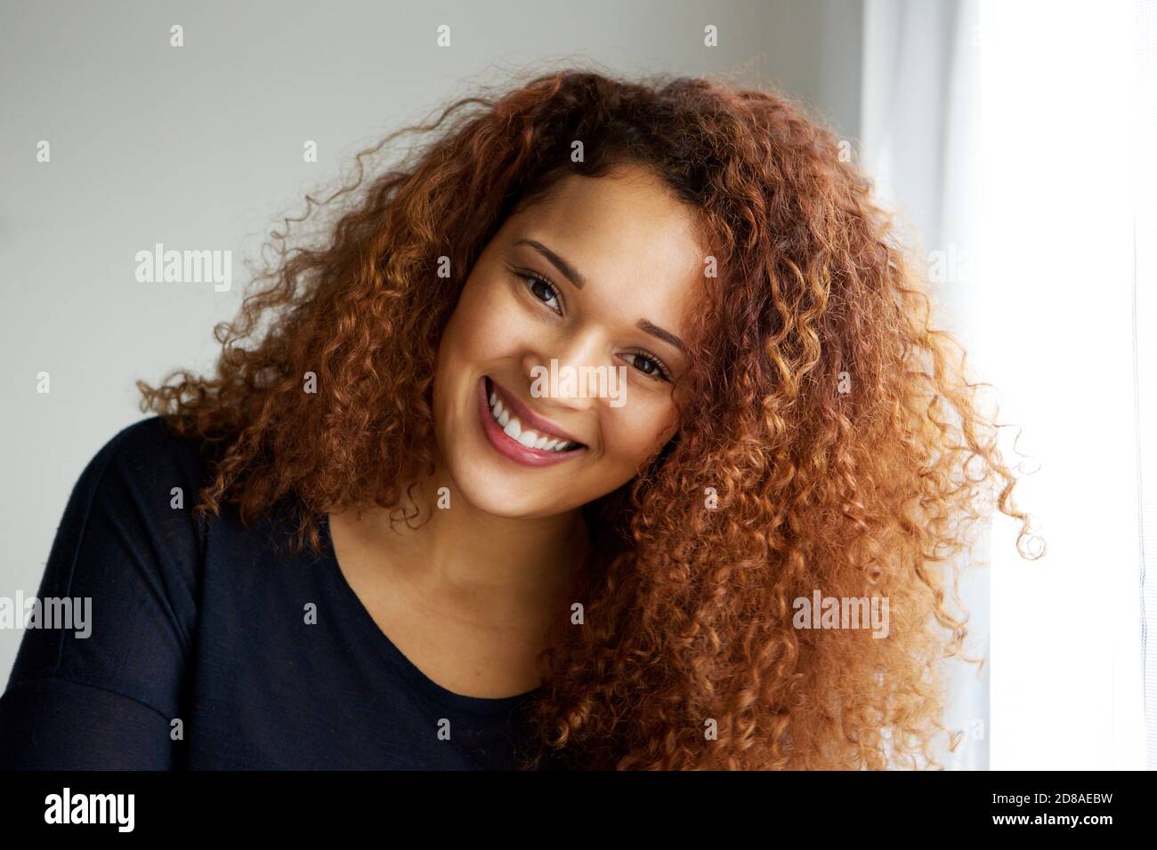 Close up portrait of beautiful young black woman with curly hair Stock ...