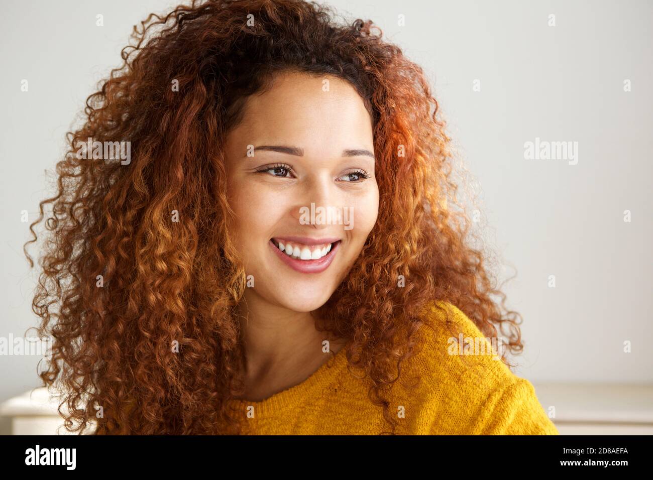 Happy young mixed race woman hi-res stock photography and images - Alamy