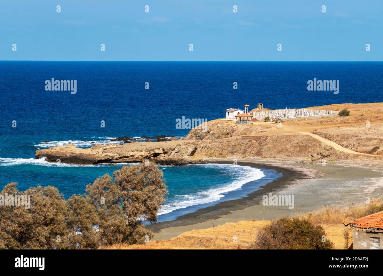 Small cemetery and church at Pachyammos bay on the north west coast of Cyprus. Stock Photo