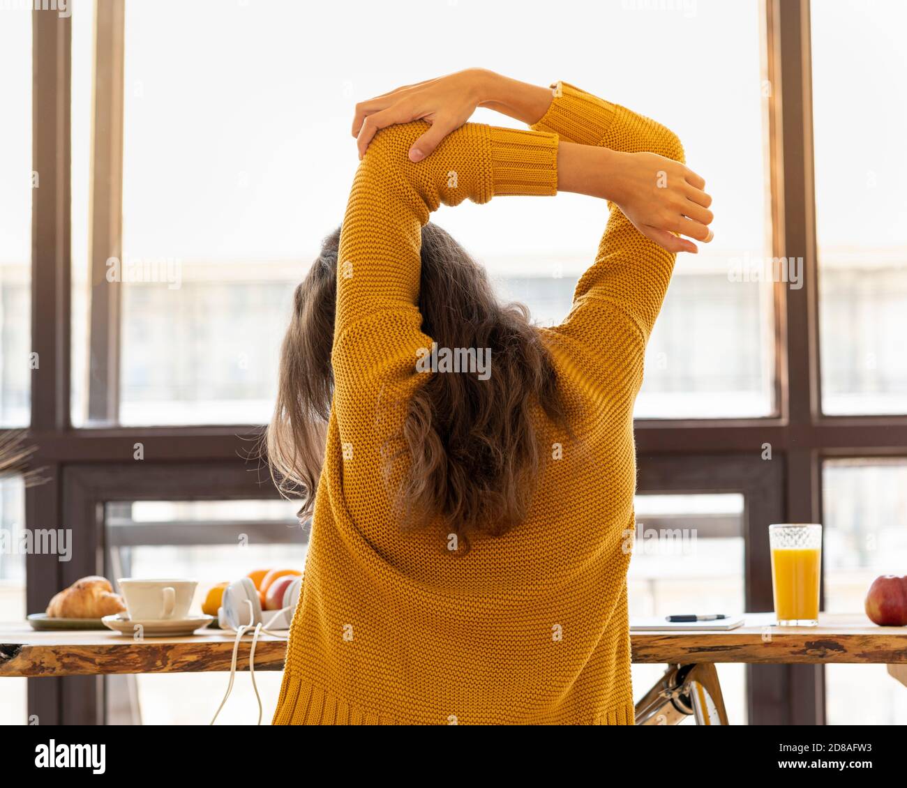 Back view of faceless young woman with stiff muscles, tense and joints ache Stock Photo