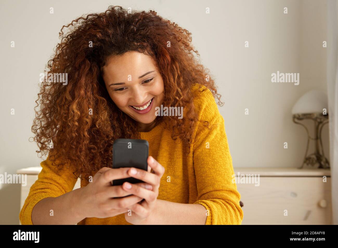 Happy young mixed race woman hi-res stock photography and images - Alamy