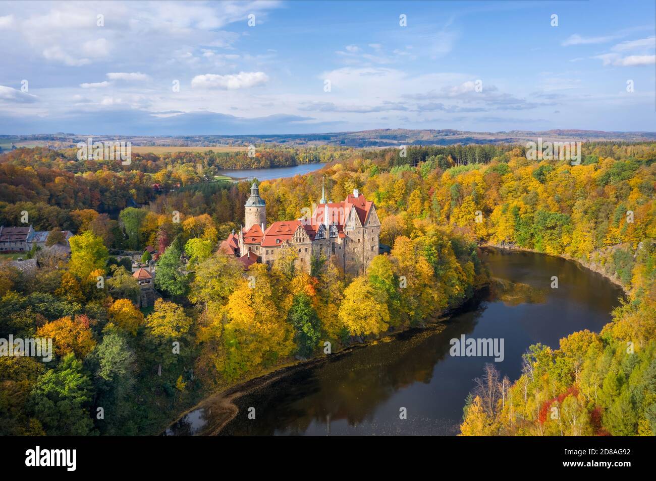 Aerial view of Czocha Castle surrounded by autumn forest and Lesnianskie Lake Stock Photo