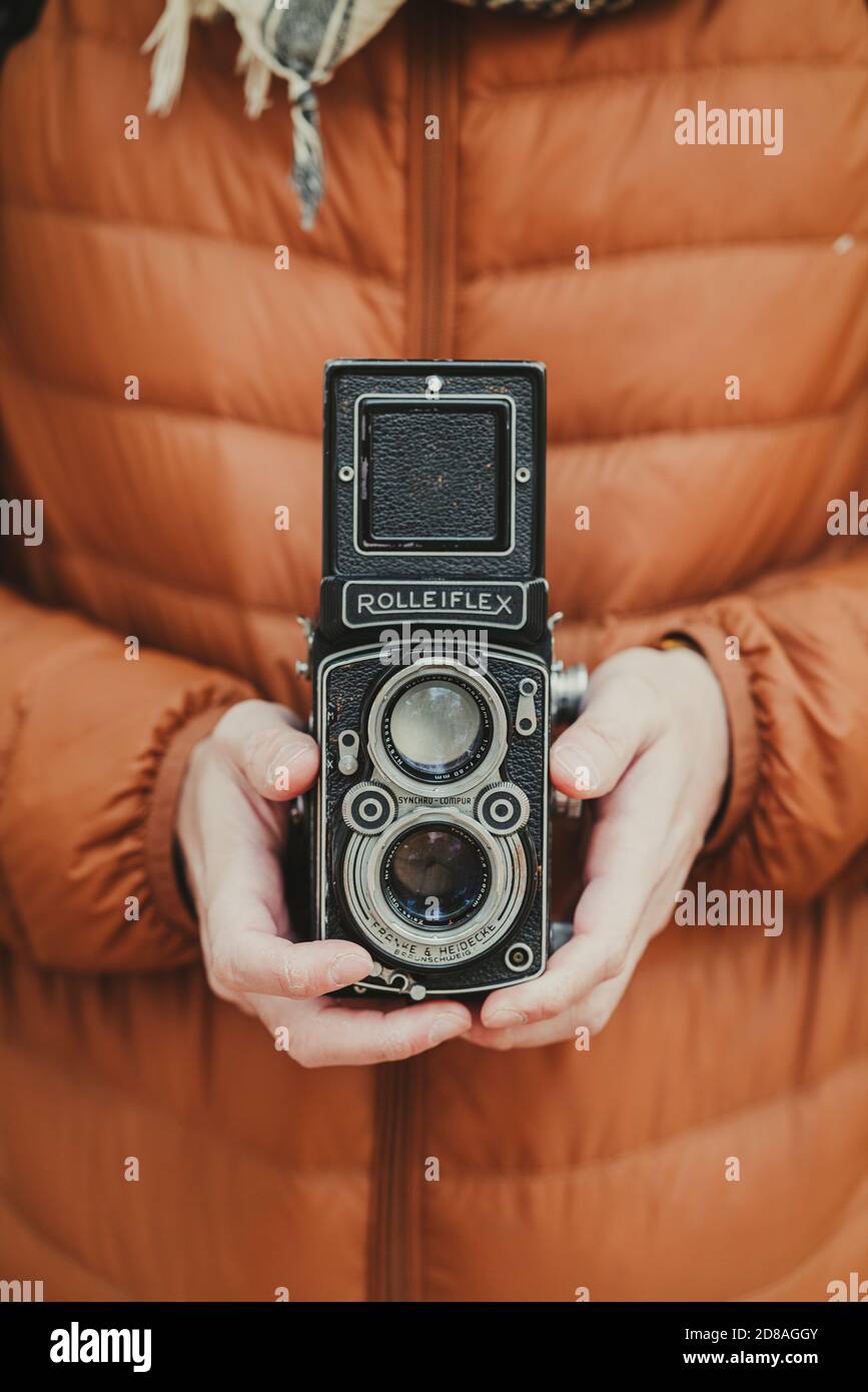 Taking pictures with a beautiful old twin lens camera Rolleiflex Stock Photo