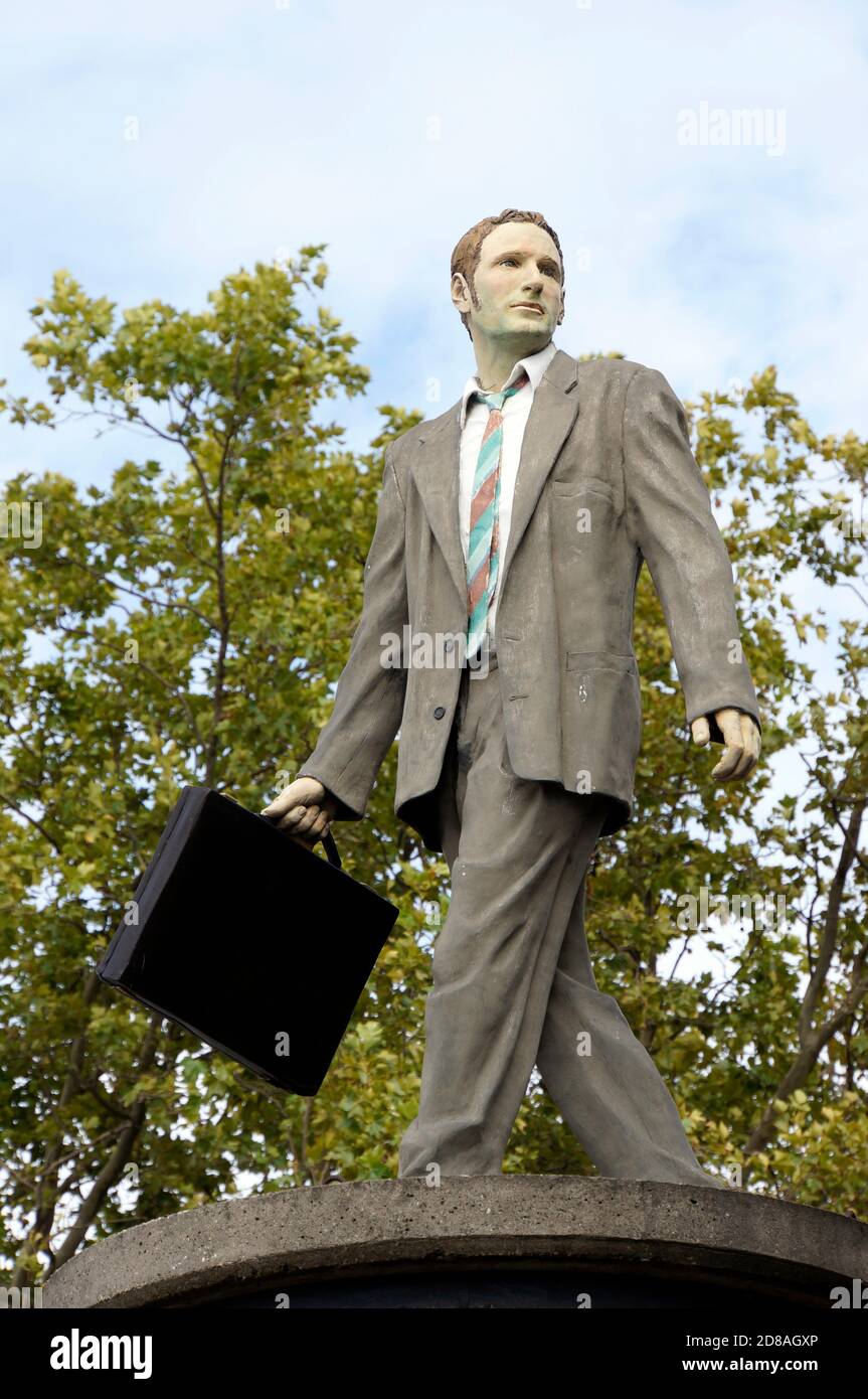 Mann im Anzug mit Aktentasche auf Litfasssäule, Düsseldorf, Nordrhein-Westfalen, Deutschland Stock Photo