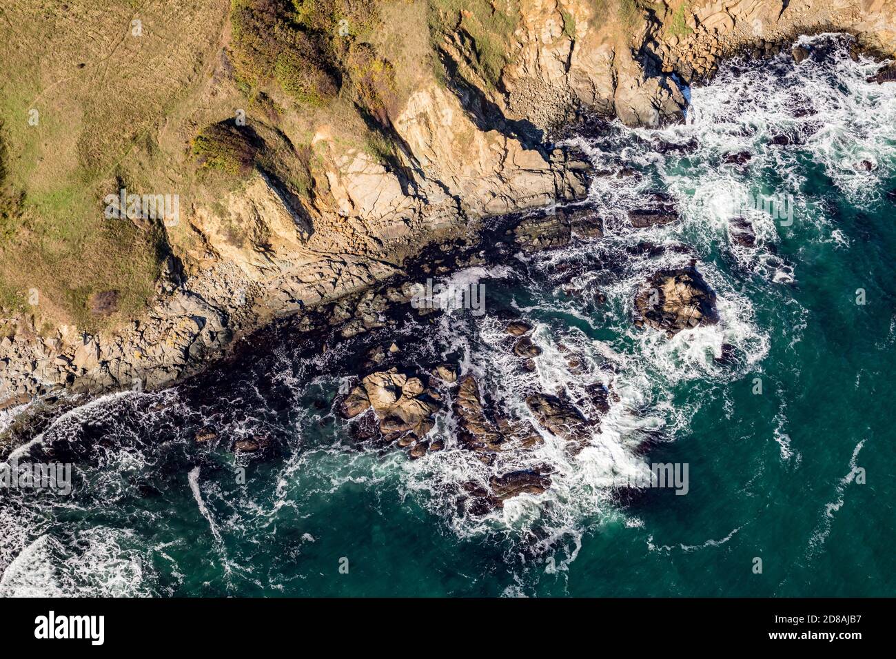 Shore cliffs, waves. Tandem motor paragliding over Black Sea shores near town of Ahtopol. Sunny autumn day, scenery colors and amazing landscapes and seascapes, Bulgaria Stock Photo