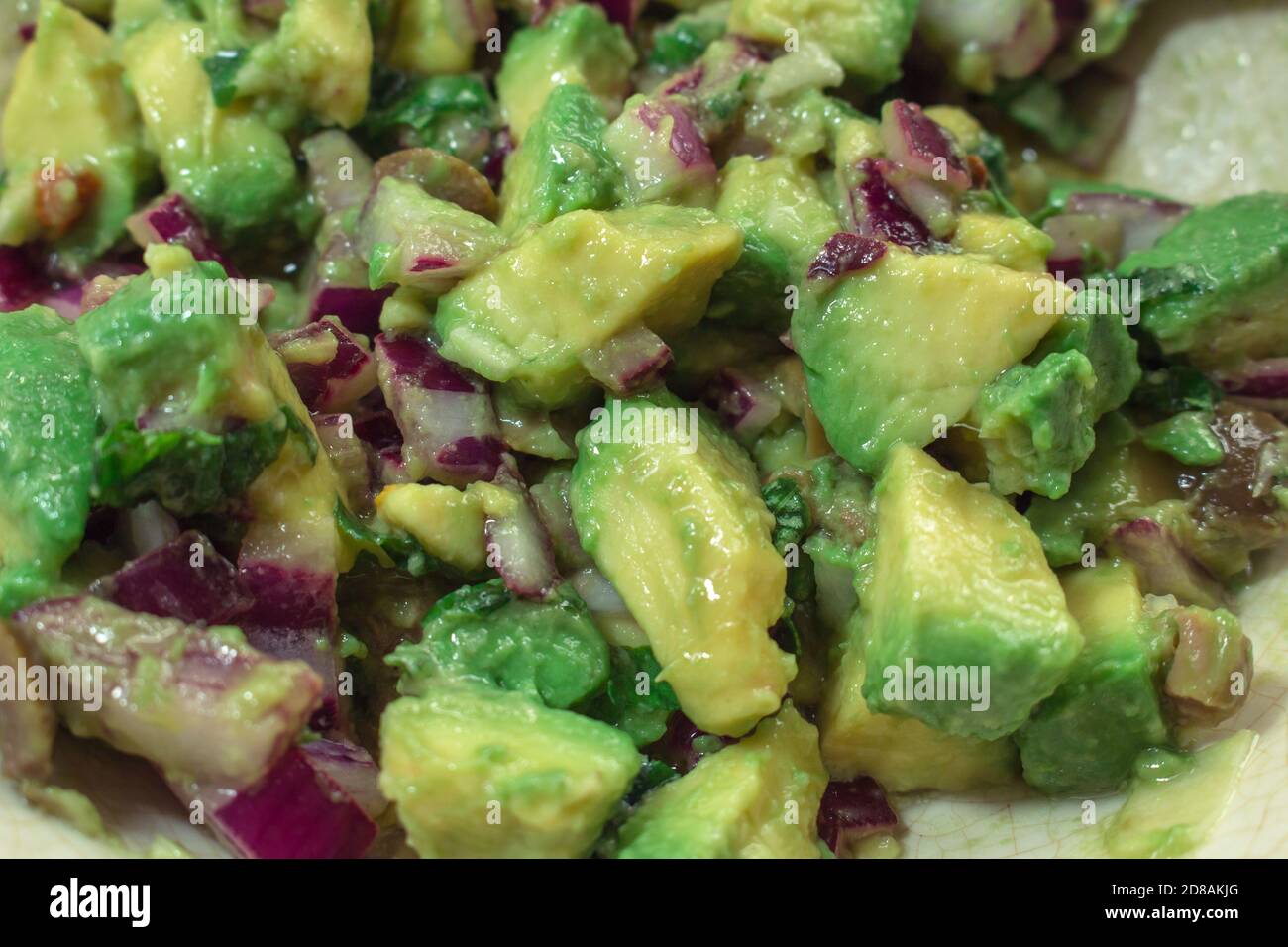 Detail of an avocado and red onion salad, guacamole Stock Photo