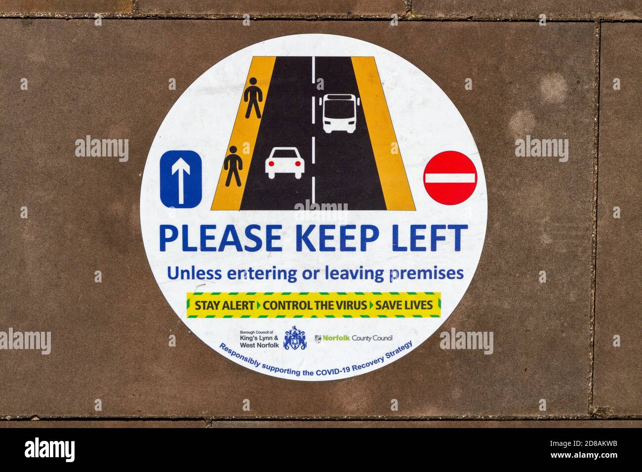 Pavement sign encouraging pedestrians to 'Please keep Left' in King's Lynn, Norfolk, England. Stock Photo
