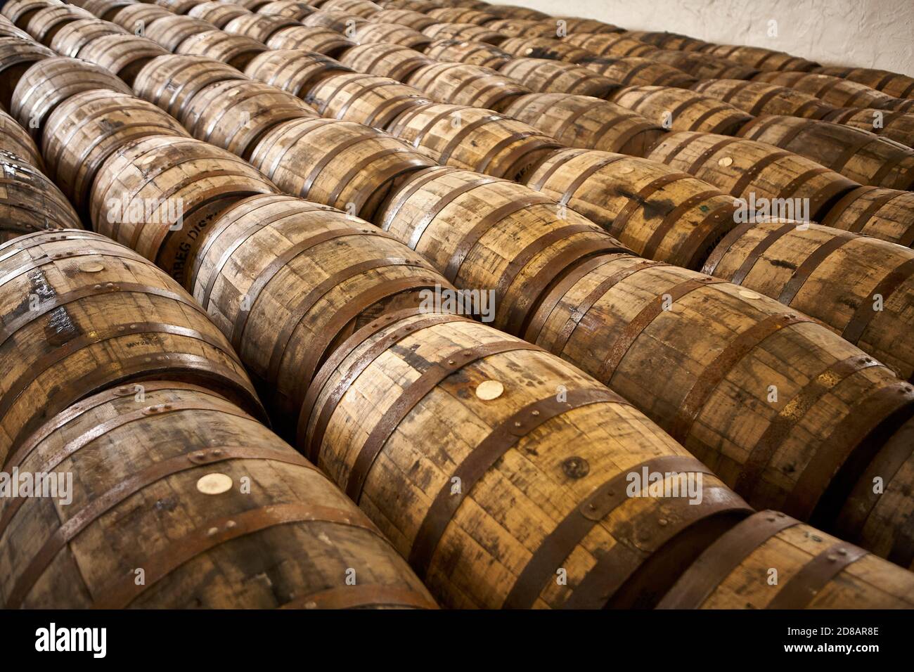 Rows of Scotch Whisky Barrels in a Warehouse Stock Photo