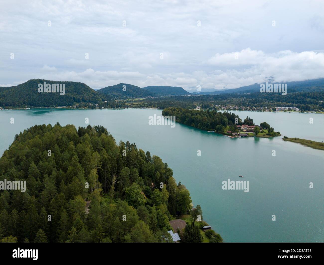 Aerial view on Lake 'Faaker See' in Carinthia (Kaernten), Austria with its famous turquoise water on a cloudy summer day Stock Photo