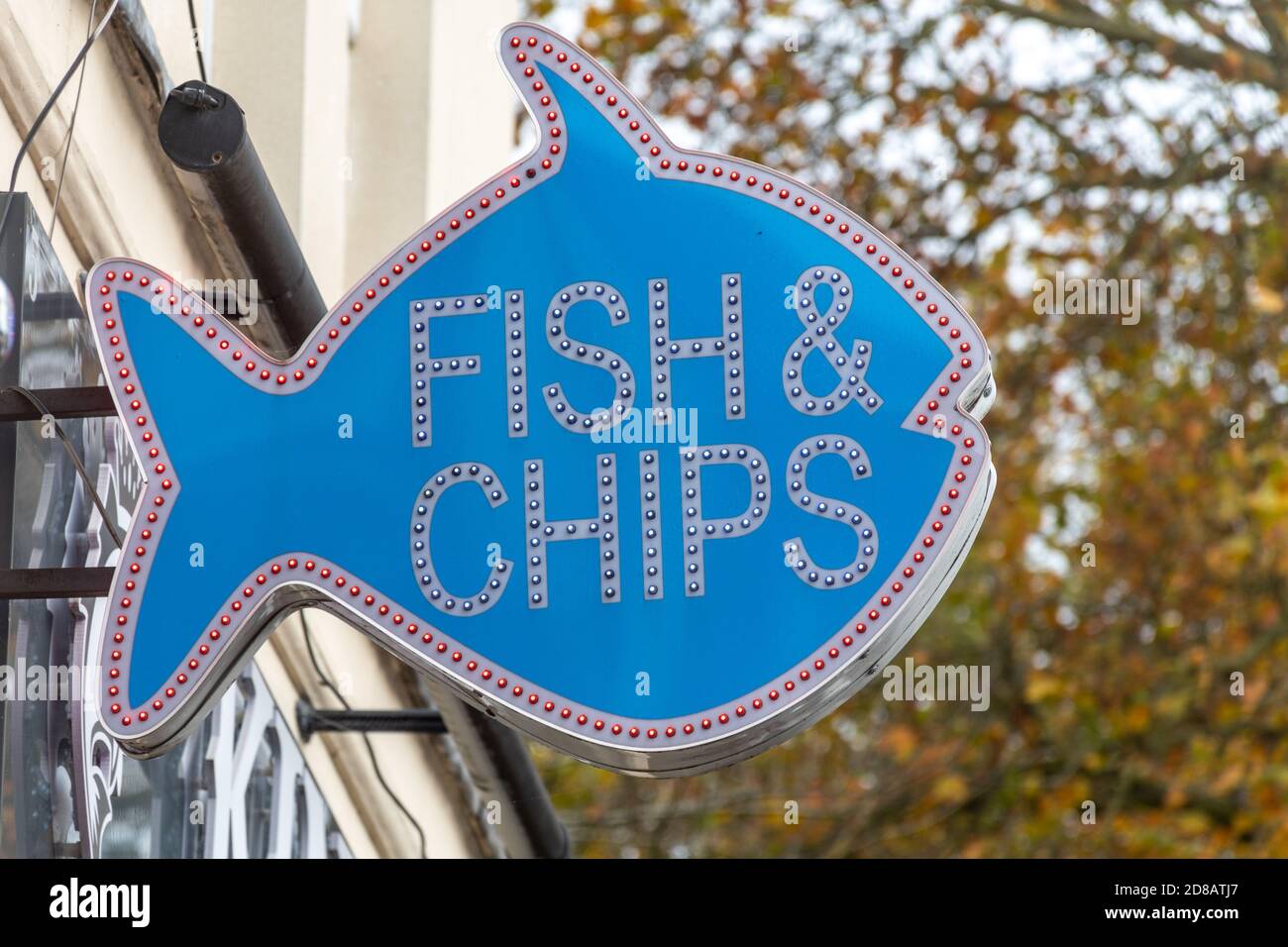 Fish & chips sign outside a takeaway food shop, UK Stock Photo