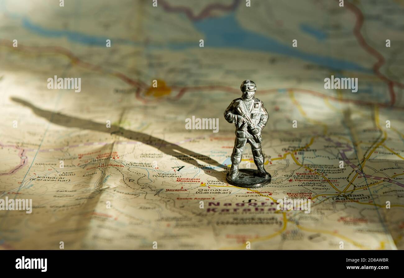 A figurine of an armed soldier on the map of Nagorno-Karabakh. Stock Photo