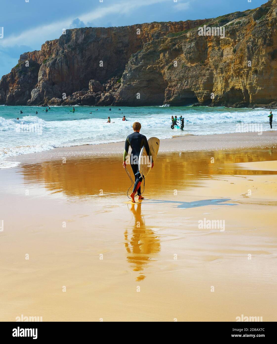 SAGRES, PORTUGAL OCTOBER 30, 2018 Man walking by sandy beach with