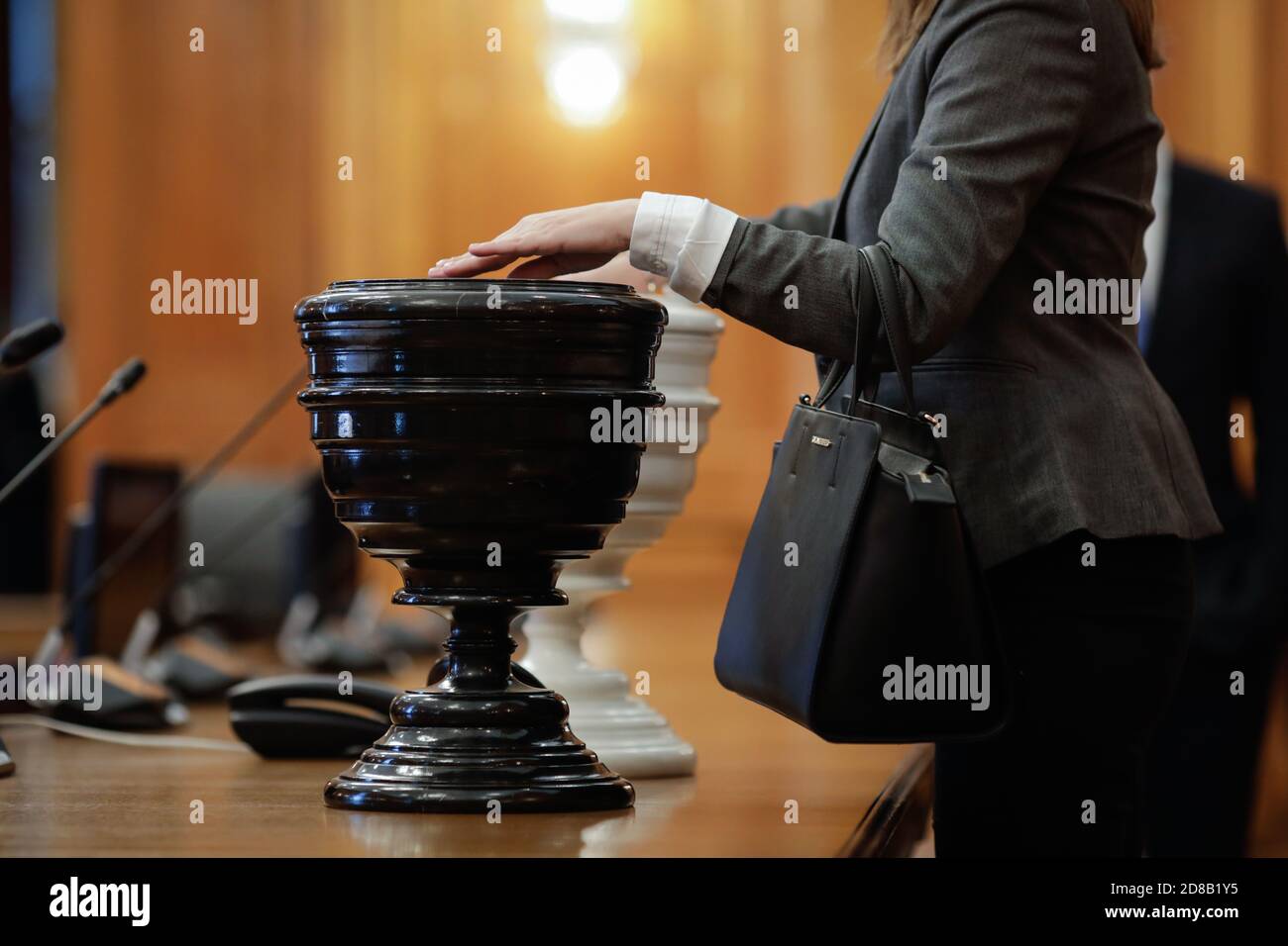 Bucharest, Romania - October 27, 2020: Details with Romanian woman MPs casting a secret vote with black and white balls (Blackballing) in black and wh Stock Photo