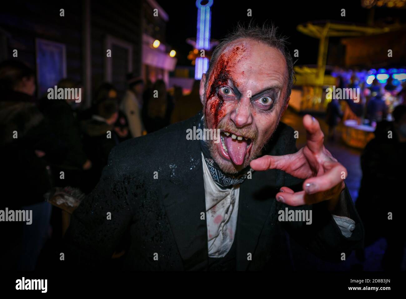 Great Yarmouth, UK. Wednesday 28 October 2020. Scare actors in Halloween costumes frighten guests at Pleasure Beach's Fairground Frights in Great Yarmouth. Credit: Thomas Faull/Alamy Live News Stock Photo