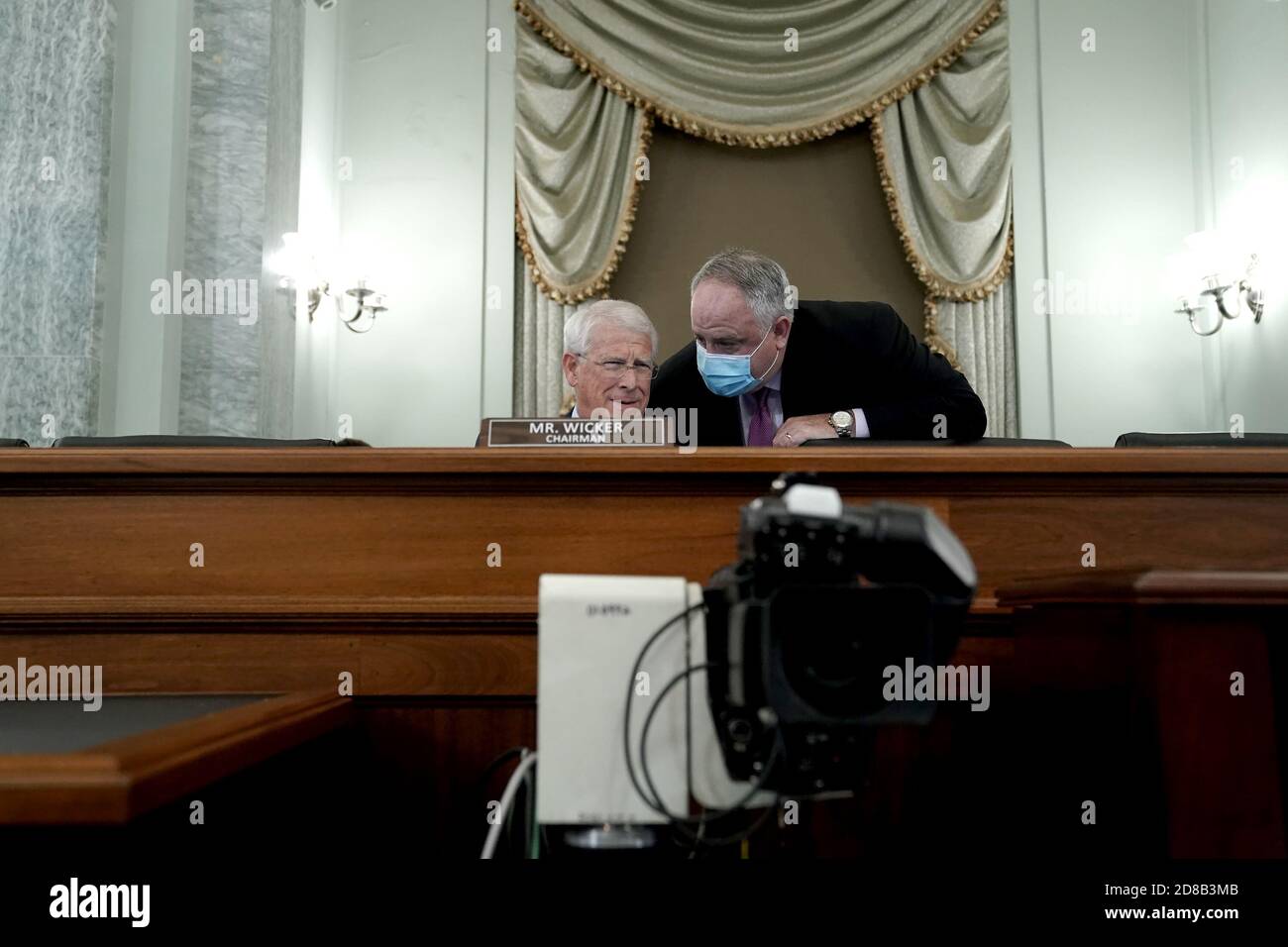 United States Senator Roger Wicker (Republican of Mississippi), Chairman, US Senate Committee on Commerce, Science, & Transportation speaks to a staffer during a hearing to discuss reforming Section 230 of the Communications Decency Act with big tech companies.Credit: Greg Nash/Pool via CNP /MediaPunch Stock Photo