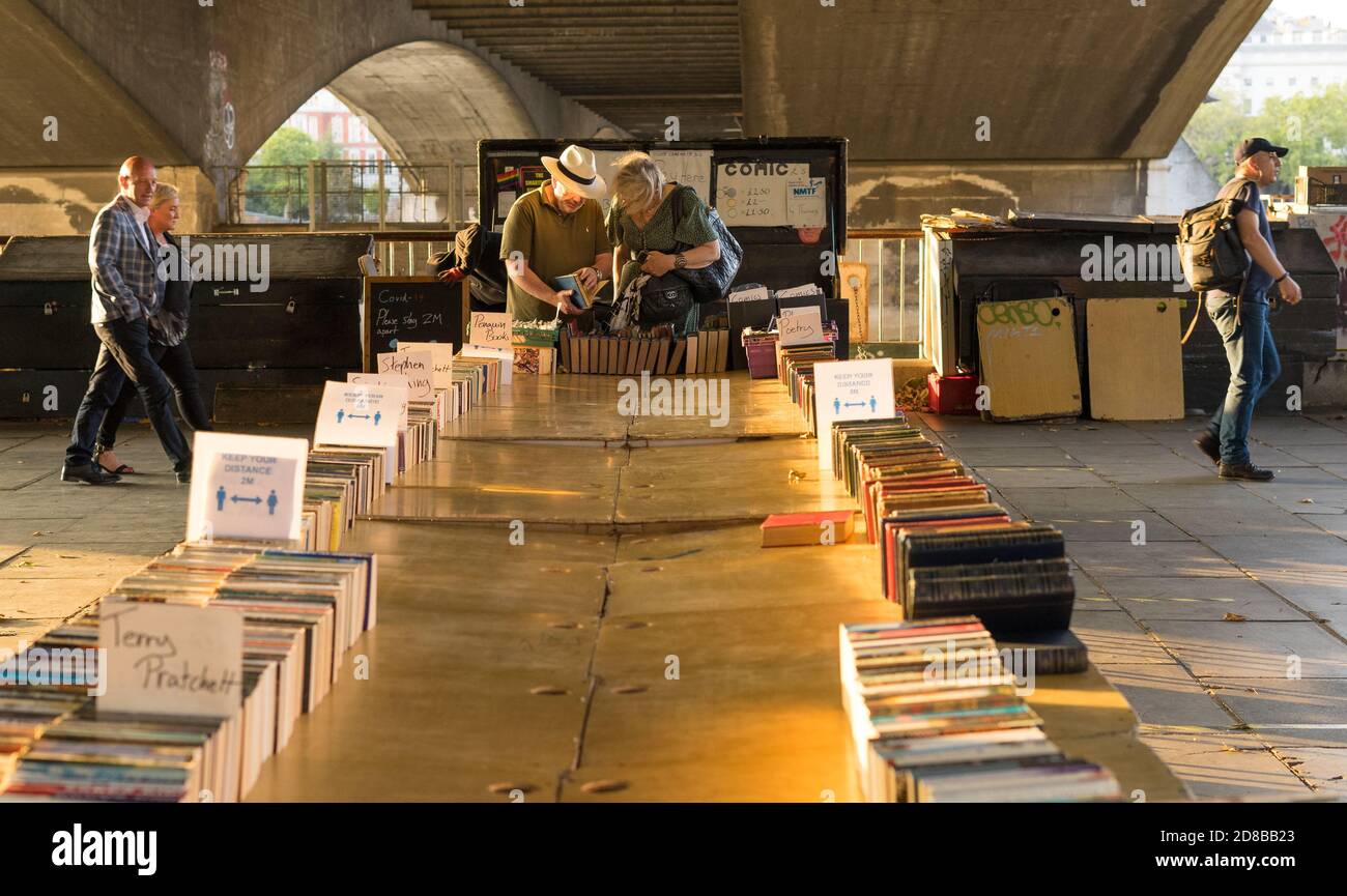 Used book market on the Southbank of the River Thames during sunset