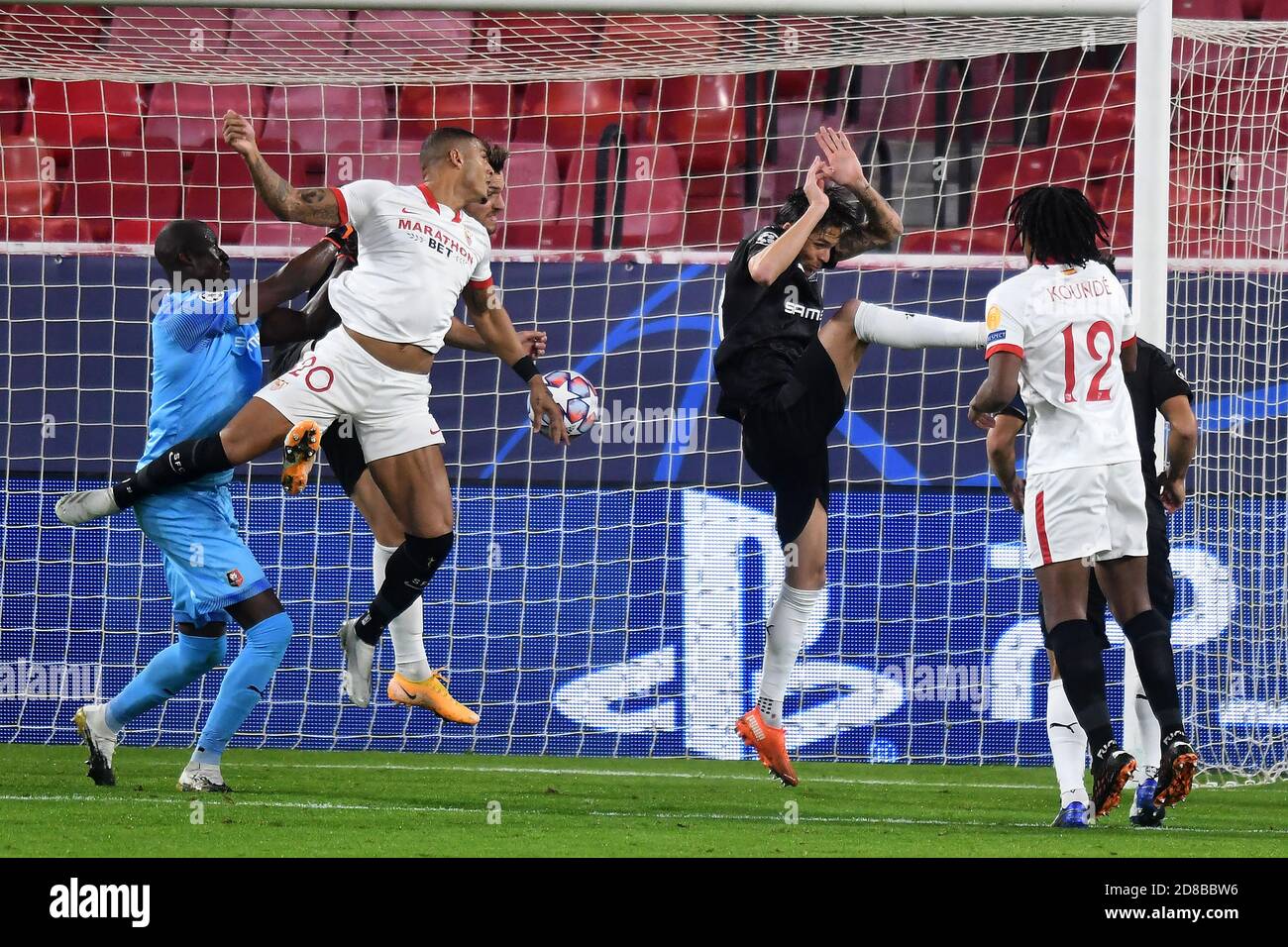 SEVILLE, SPAIN - OCTOBER 28: Diego Carlos and Jules Kounde of FC Sevilla and Alfred Gomis and Jonas Martin of Stade Rennais during the UEFA Champions League Group E stage match between FC Sevilla and Stade Rennais at Estadio Ramon Sanchez-Pizjuan on October 28, 2020 in Seville, Spain. (Photo by Juan Jose Ubeda/ MB Media). Stock Photo