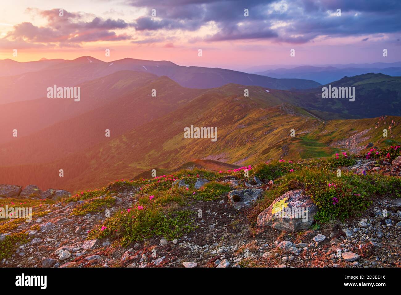 Amazing mountain landscape with colorful vivid sunset on the cloudy sky ...