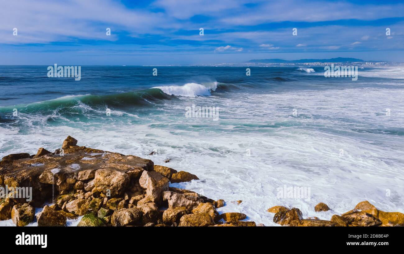 Aerial top view of Atlantic ocean big waves hitting rocks on the beach ...