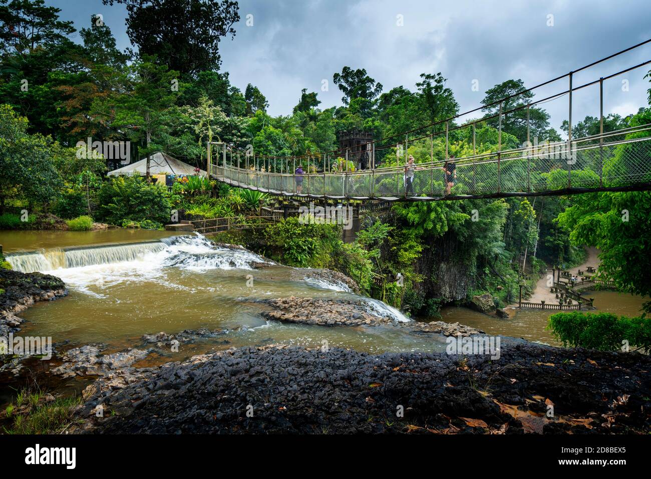 Suspension footbridge above Mena Creek Falls, Paronella Park, near Innisfail, North Queensland, Australia Stock Photo