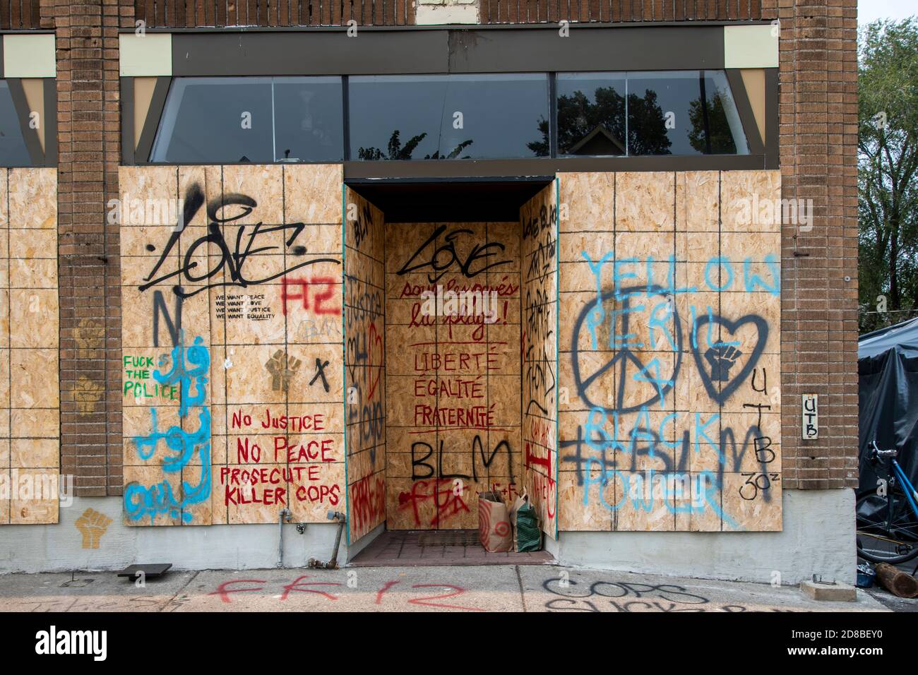 Minneapolis, MN.  Street art and graffiti on boarded up business at George Floyd memorial site. Stock Photo