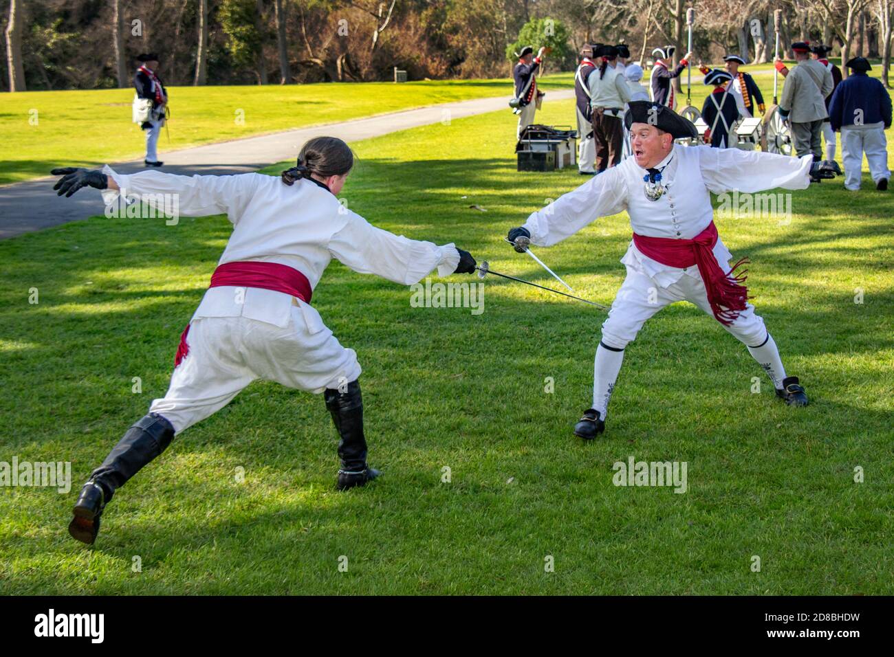 Actors in 18th-century British army uniforms demonstrate fighting techniques with short swords at an American Revolutionary War reenactment in a Hunti Stock Photo