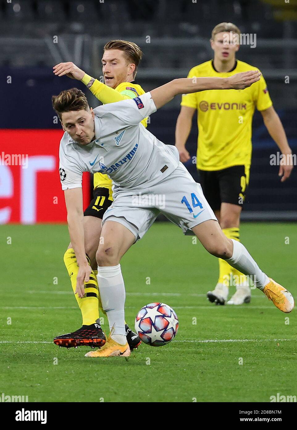 Dortmund, Germany. 28th Oct, 2020. Marco Reus (C) of Dortmund vies with Daler Kuzyayev of Zenit during the UEFA Champions League Group F football match between Borussia Dortmund and FC Zenit in Dortmund, Germany, Oct. 28, 2020. Credit: Joachim Bywaletz/Xinhua/Alamy Live News Stock Photo