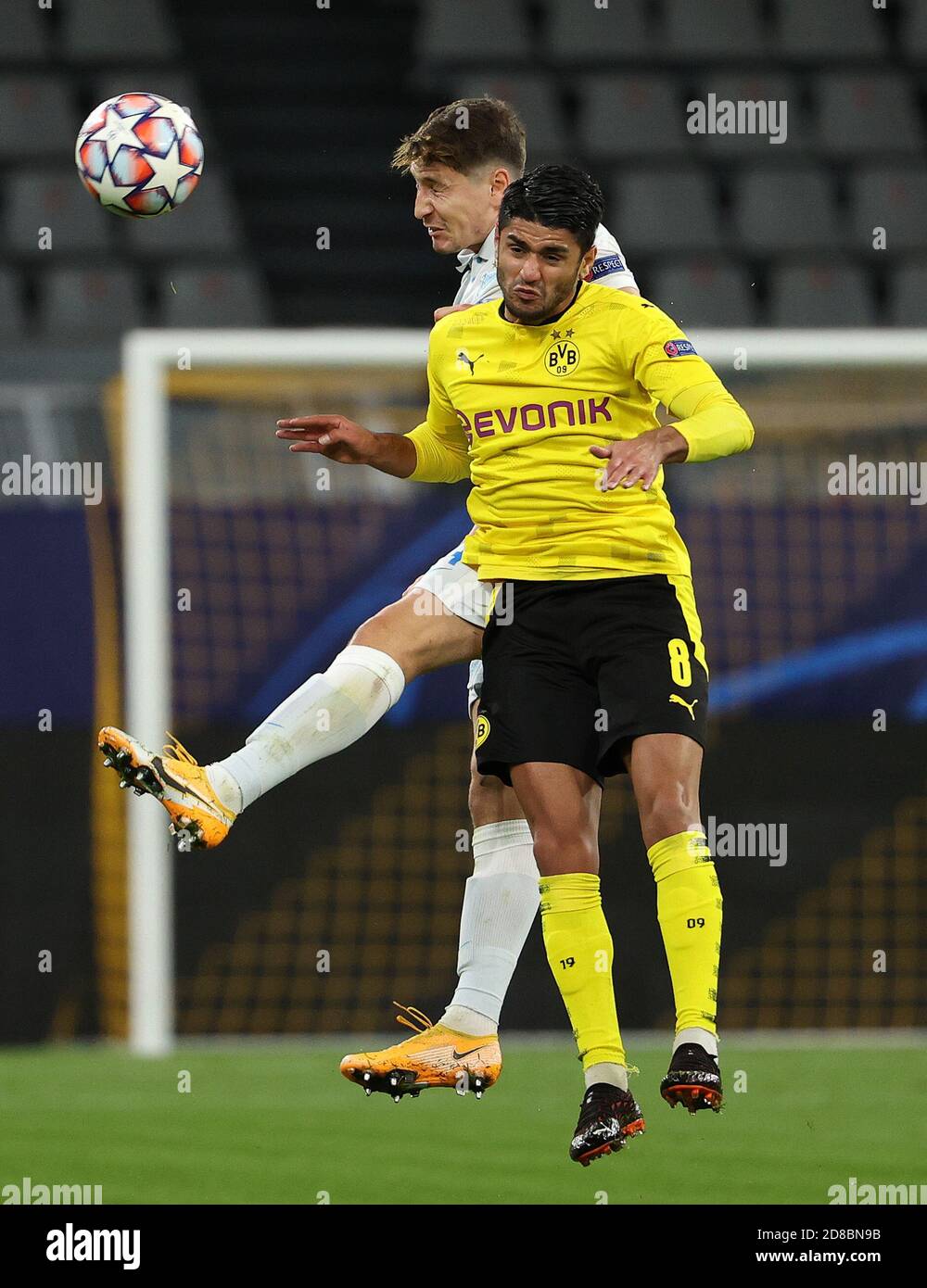 Dortmund, Germany. 28th Oct, 2020. Mahmoud Dahoud (front) of Dortmund vies for a header with Daler Kuzyayev of Zenit during the UEFA Champions League Group F football match between Borussia Dortmund and FC Zenit in Dortmund, Germany, Oct. 28, 2020. Credit: Joachim Bywaletz/Xinhua/Alamy Live News Stock Photo