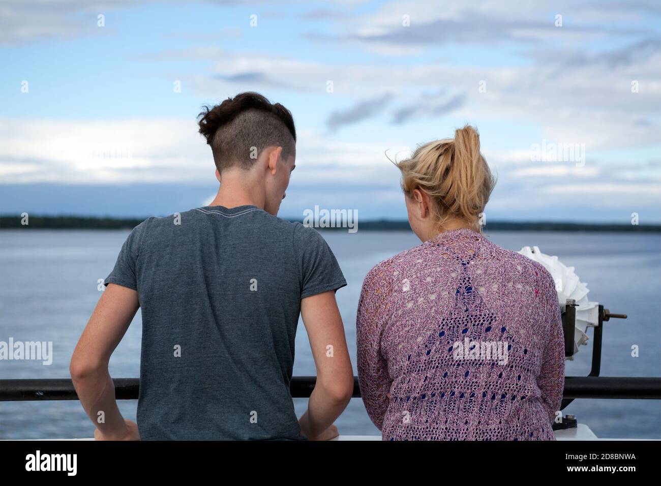 A man and woman converse on a ferry headed to Washington Island in  Wisconsin, USA. Stock Photo