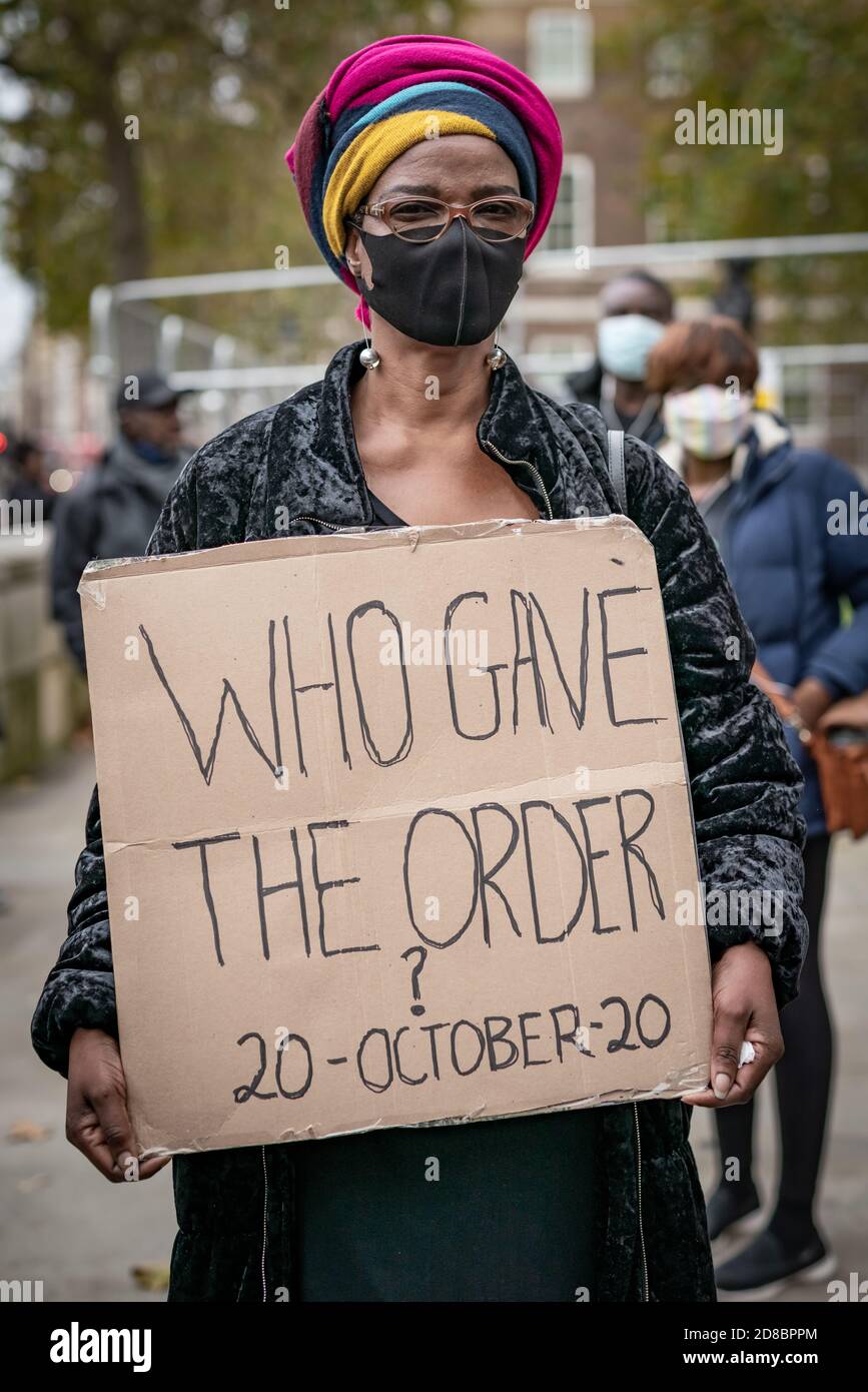 British-Nigerians demonstrate opposite Downing Street against police brutality carried out by a unit of the Nigerian police force called SARS. London. Stock Photo