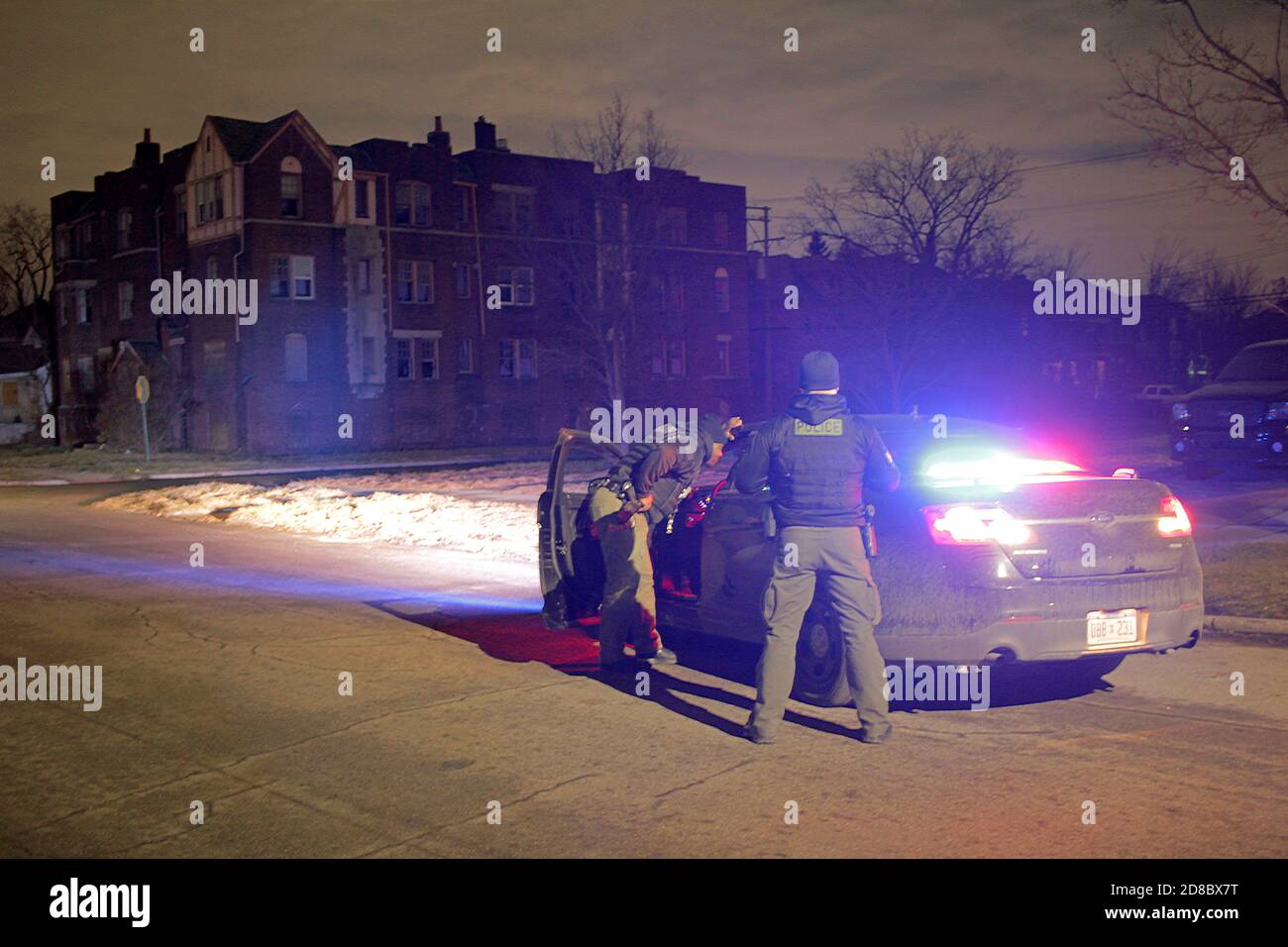 Detroit police officers in the street at night, Detroit, Michigan, USA Stock Photo