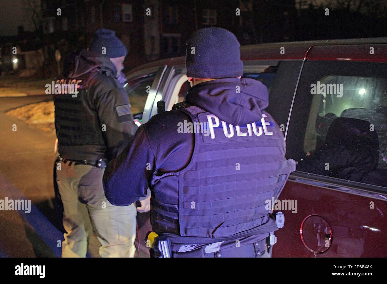 Detroit Special Operations police officers check a vehicle at night, Detroit, Michigan, USA Stock Photo