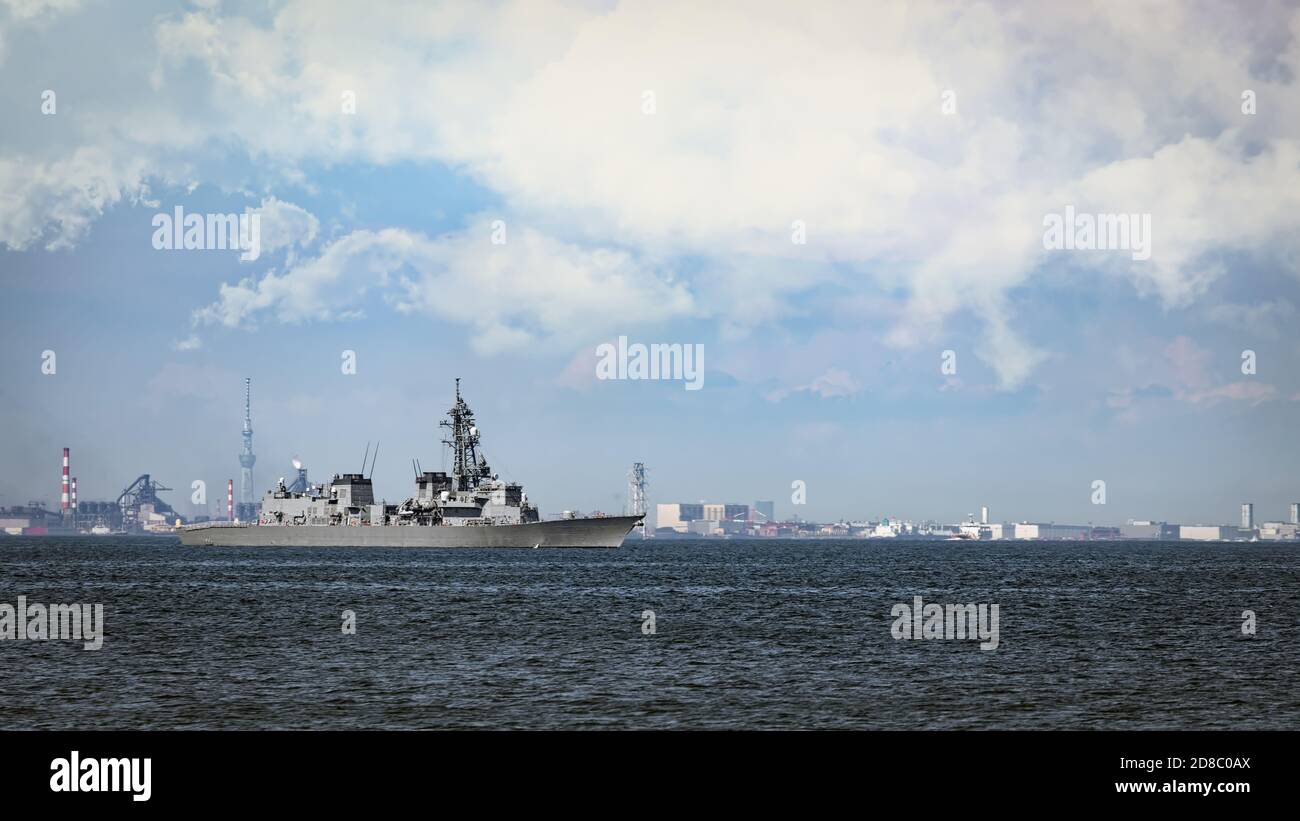 A Japan Maritime Self-Defense Force (JMSDF) destroyer sits in Tokyo Bay of the coast of Yokusuka, Japan. Stock Photo