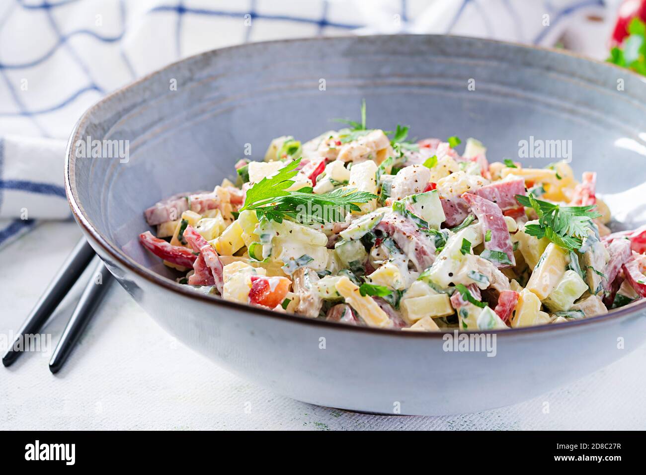Trendy salad. Salad with ham, paprika, cucumber and cheese. Healthy